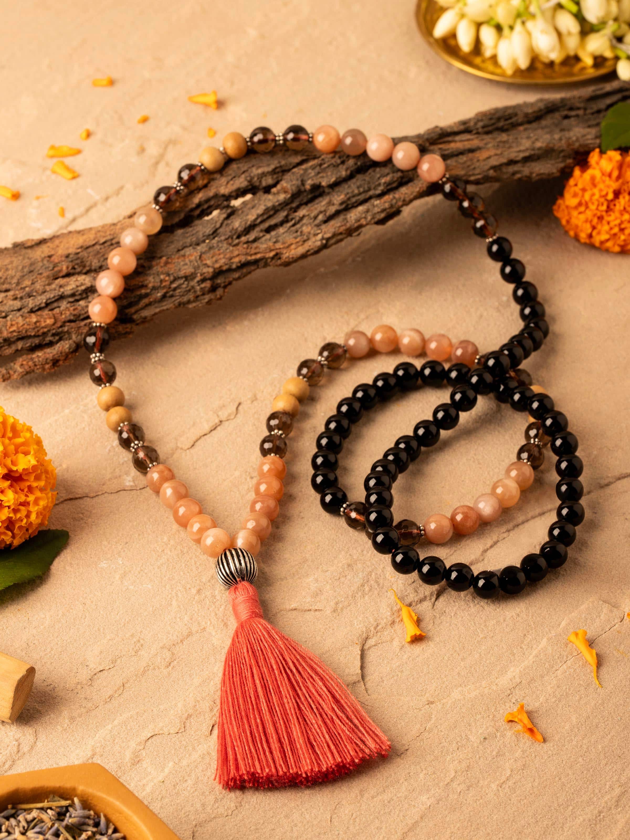 Close-up view of Smoky Quartz, Red Onyx, Peach Moonstone & Rudraksha Silver Mala highlighting intricate bead details and silver accents