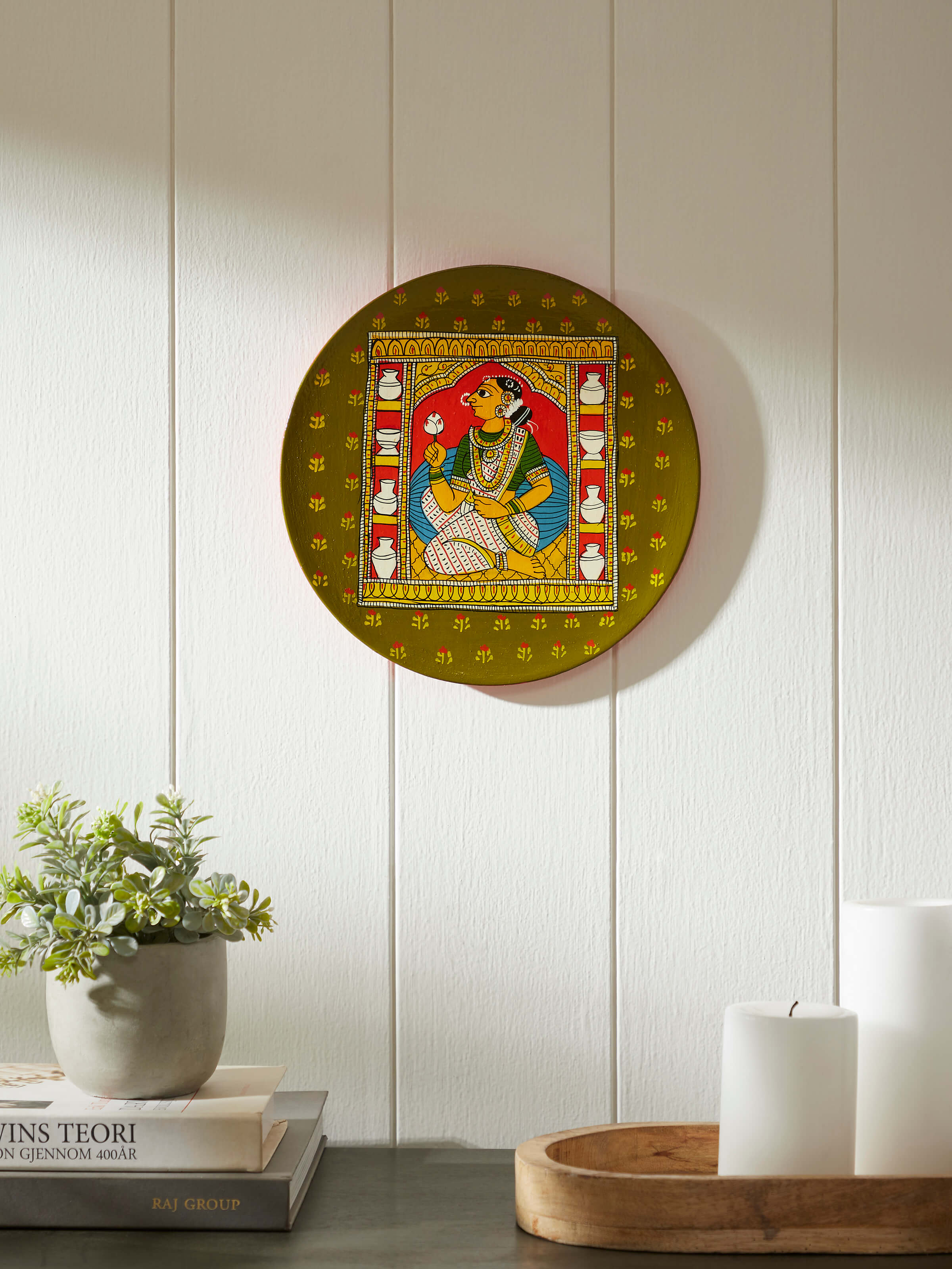 Side view of Cheriyal lady display plate, showcasing the detailed artwork.