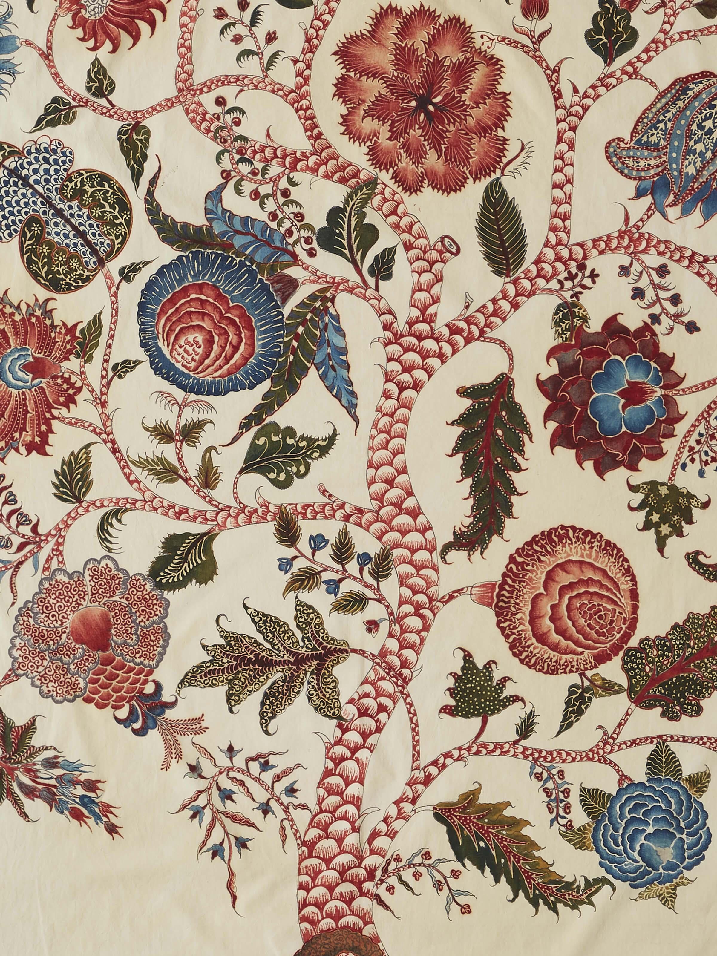 Close-up of Kalamkari divine tree painting showcasing fine brushwork and vibrant hues.