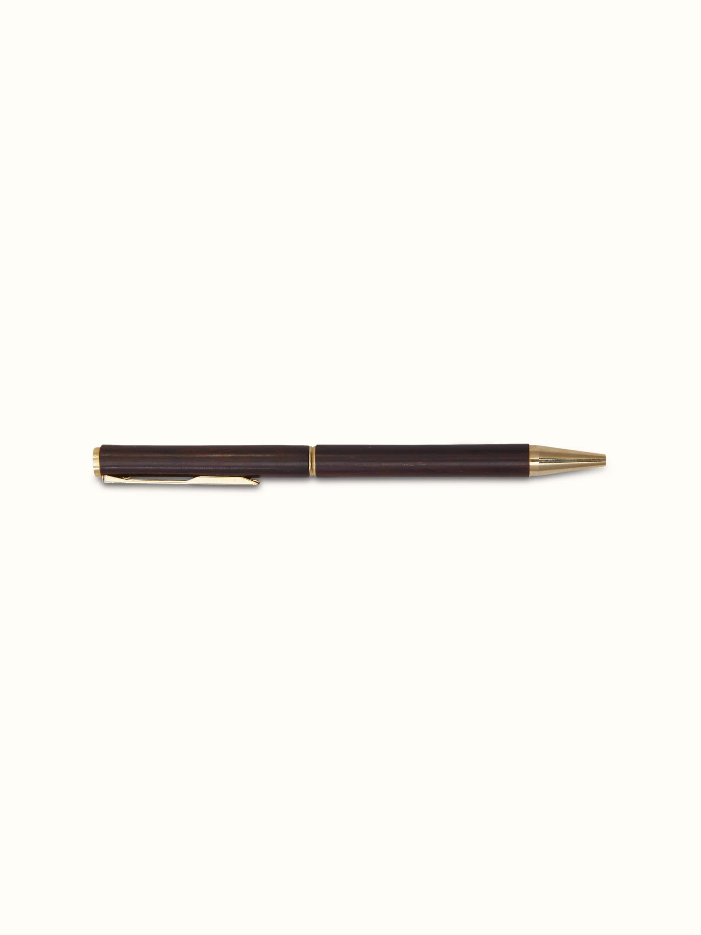Angled view of Carved Rosewood Pen, highlighting the intricate carvings and craftsmanship