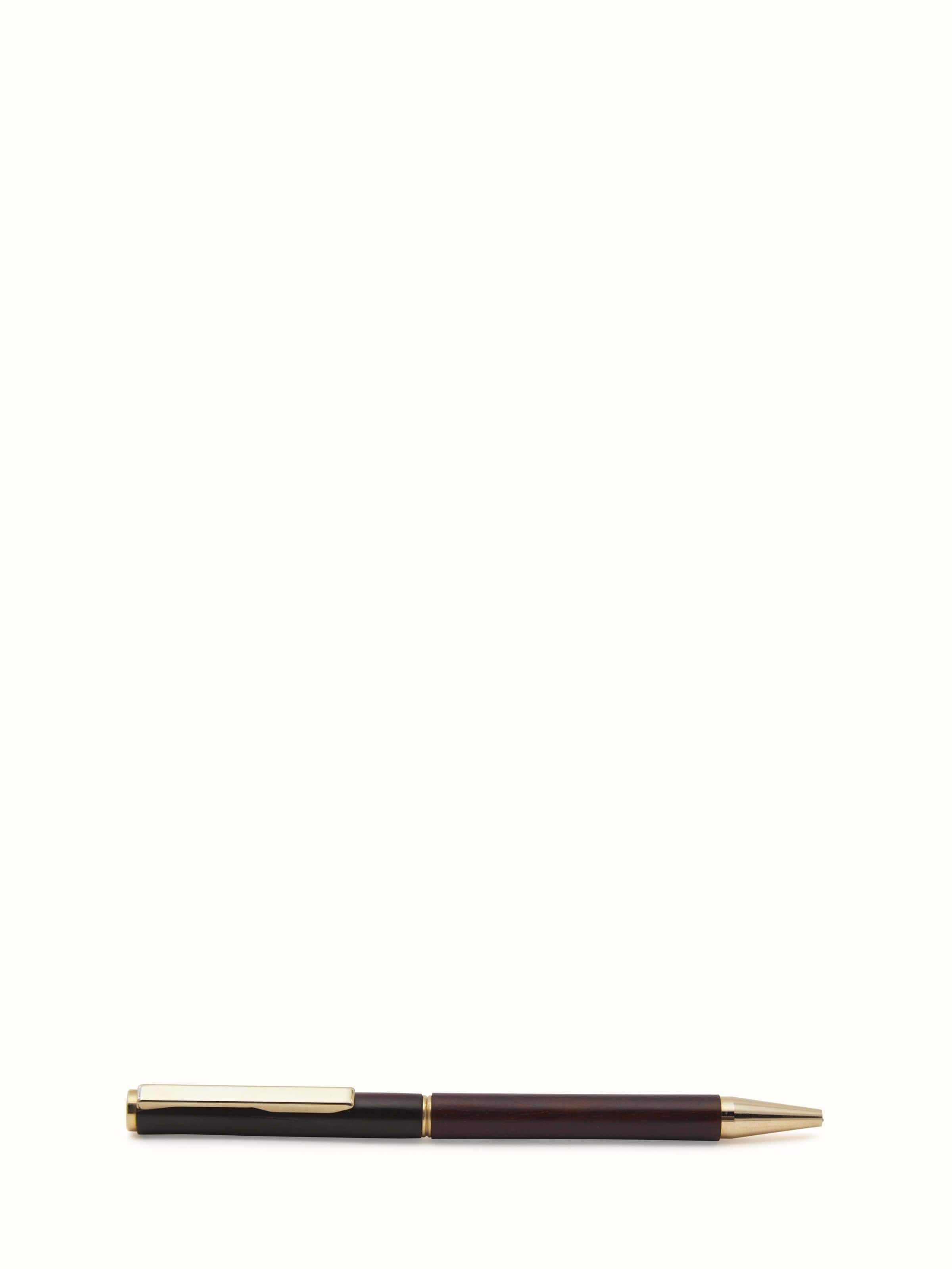 Close-up of Carved Rosewood Pen, emphasizing detailed carving and elegant design