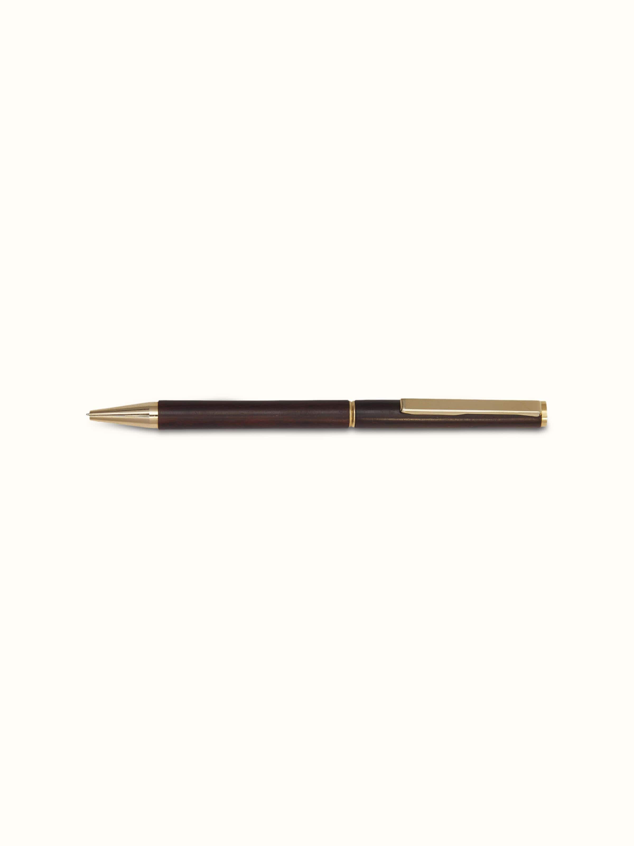 Detailed view of Carved Rosewood Pen, showing fine craftsmanship and rich wood texture
