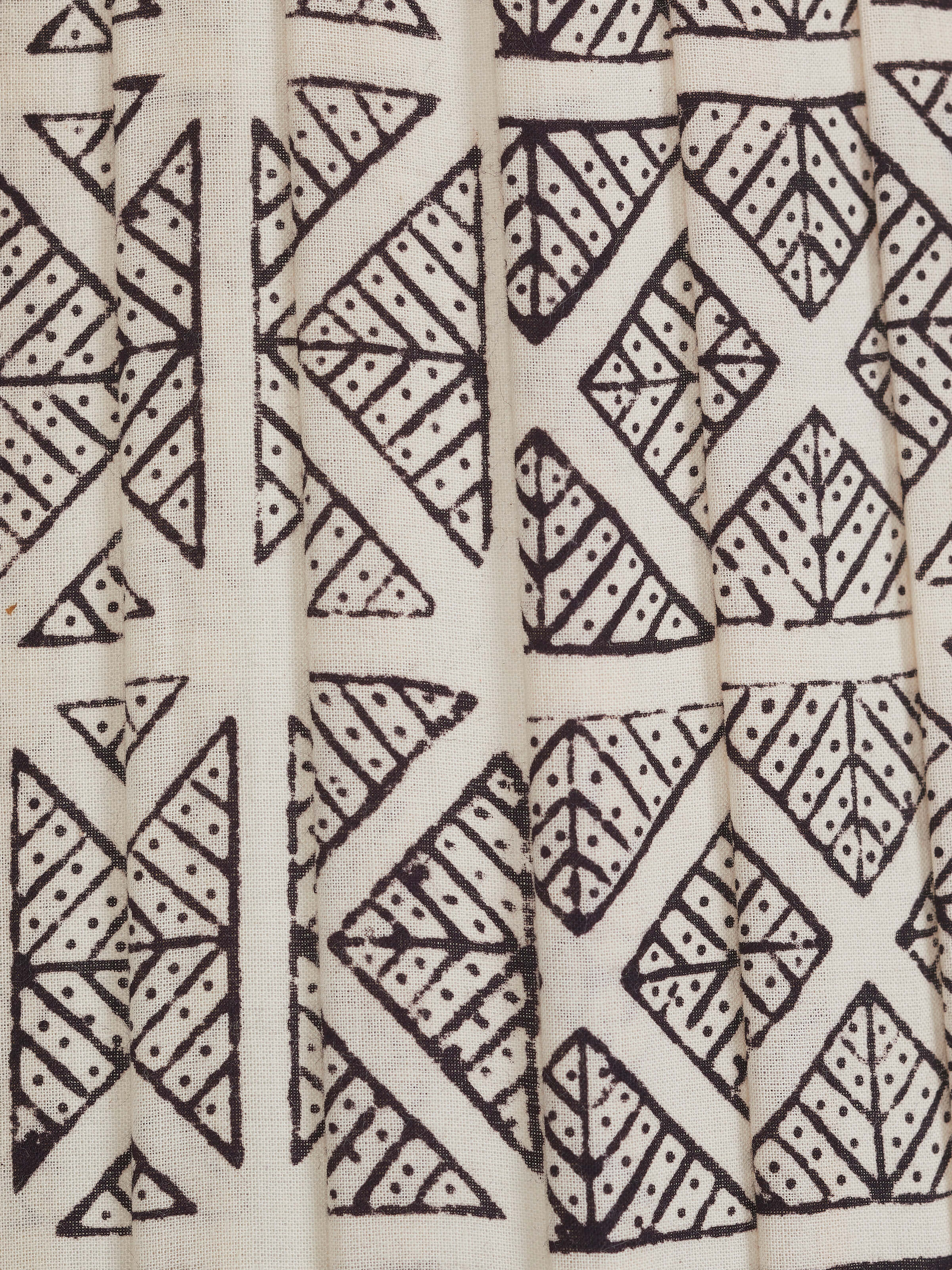 Close-up view of Bagh block-printed cotton lampshade in monochrome highlighting the fine details of the print