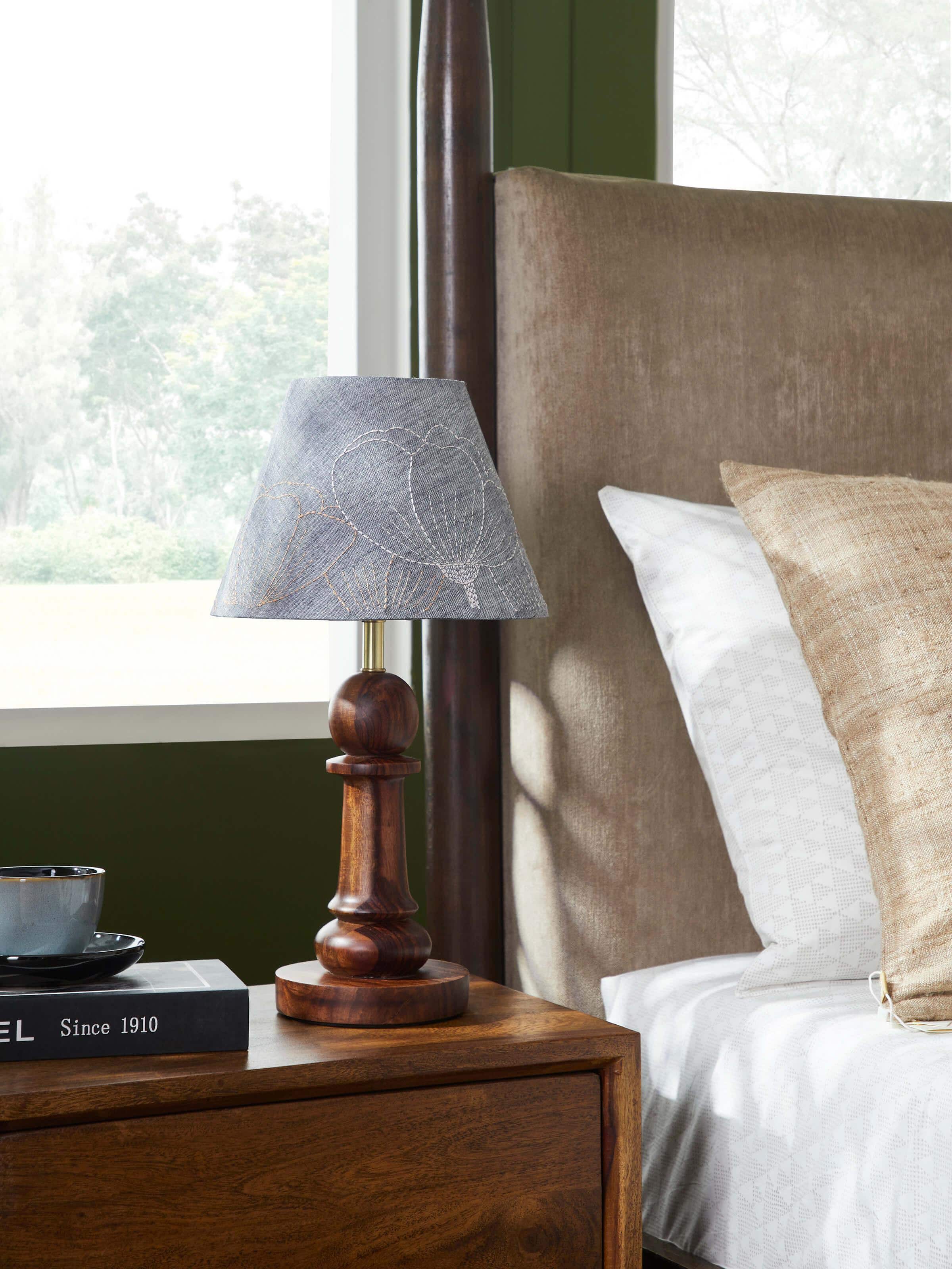 Side view of Sujani embroidered cotton lampshade in medium grey color highlighting intricate embroidery details and craftsmanship