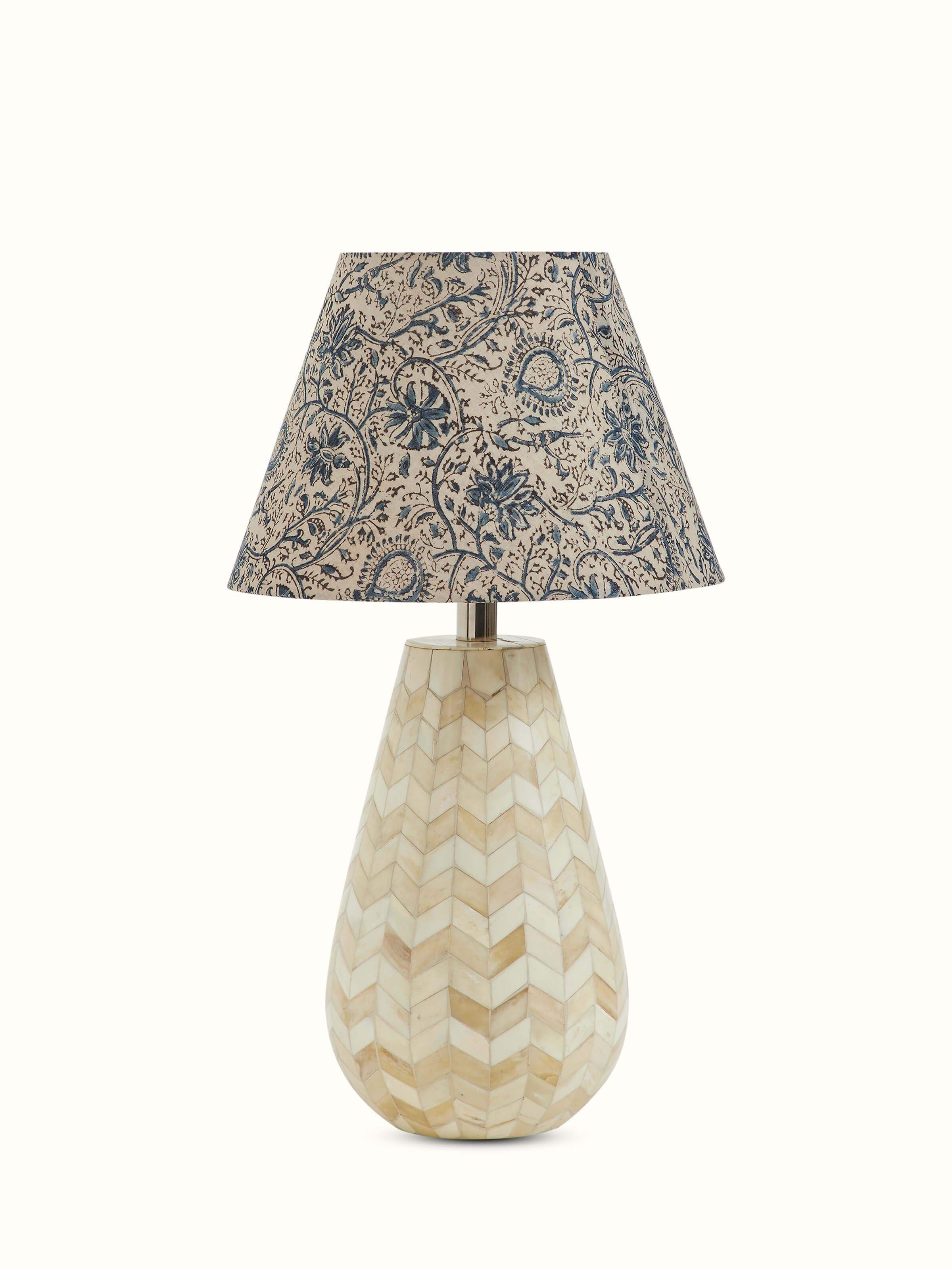 Front view of Sugauli kalamkari block-printed cotton lampshade in blue color displaying its traditional motifs