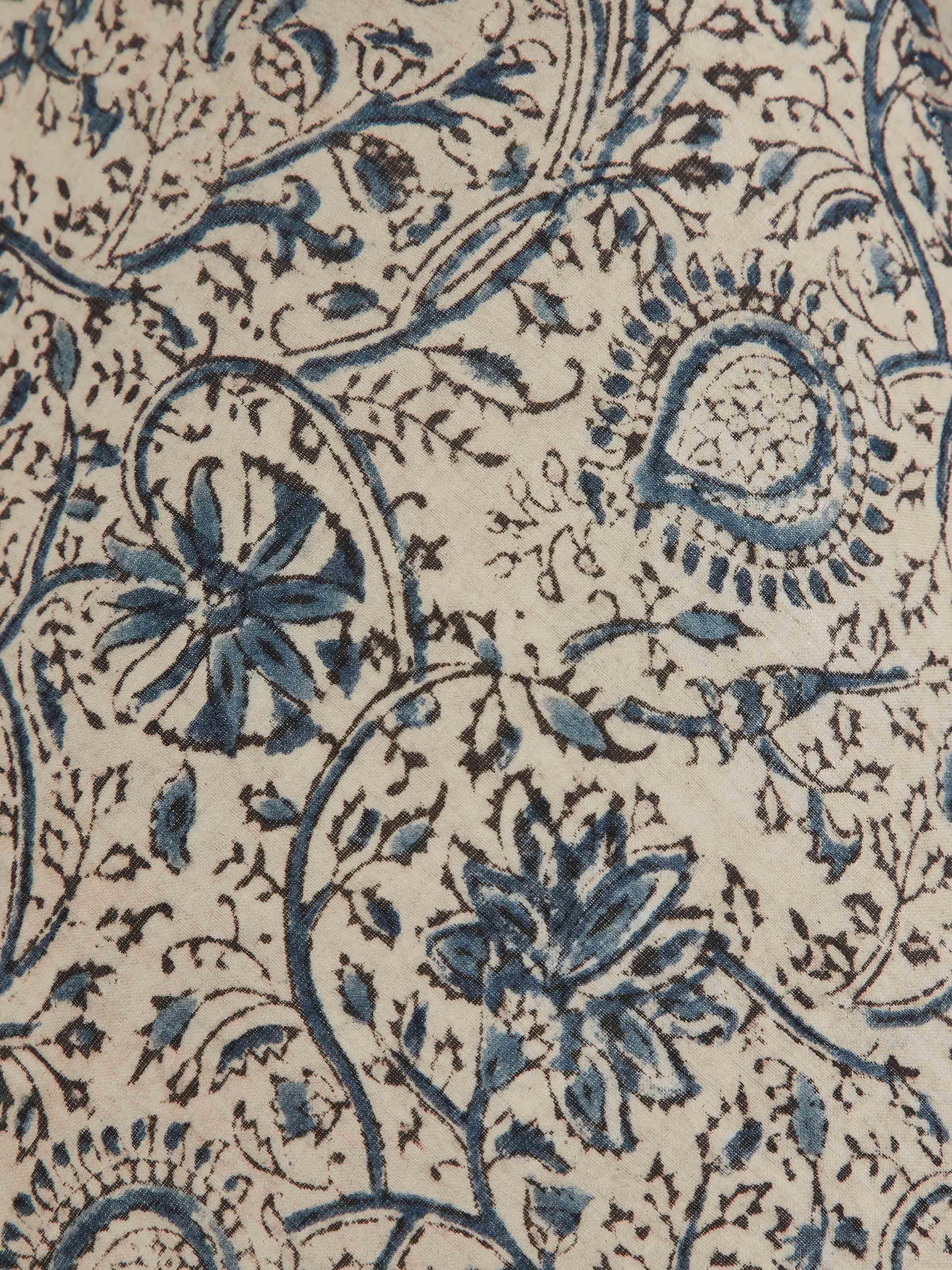 Close-up of Sugauli kalamkari block-printed cotton lampshade in blue color emphasizing the intricate detailing and vibrant hues