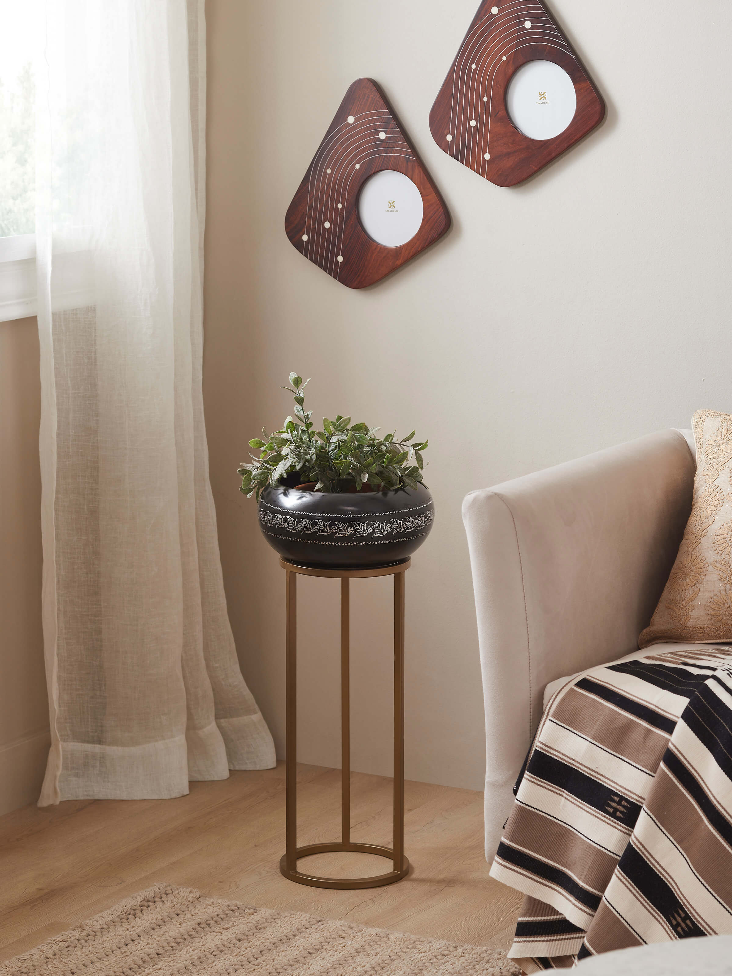 Side view of Traditional Black Pottery Ceramic Planter showcasing its smooth texture and artistic details.