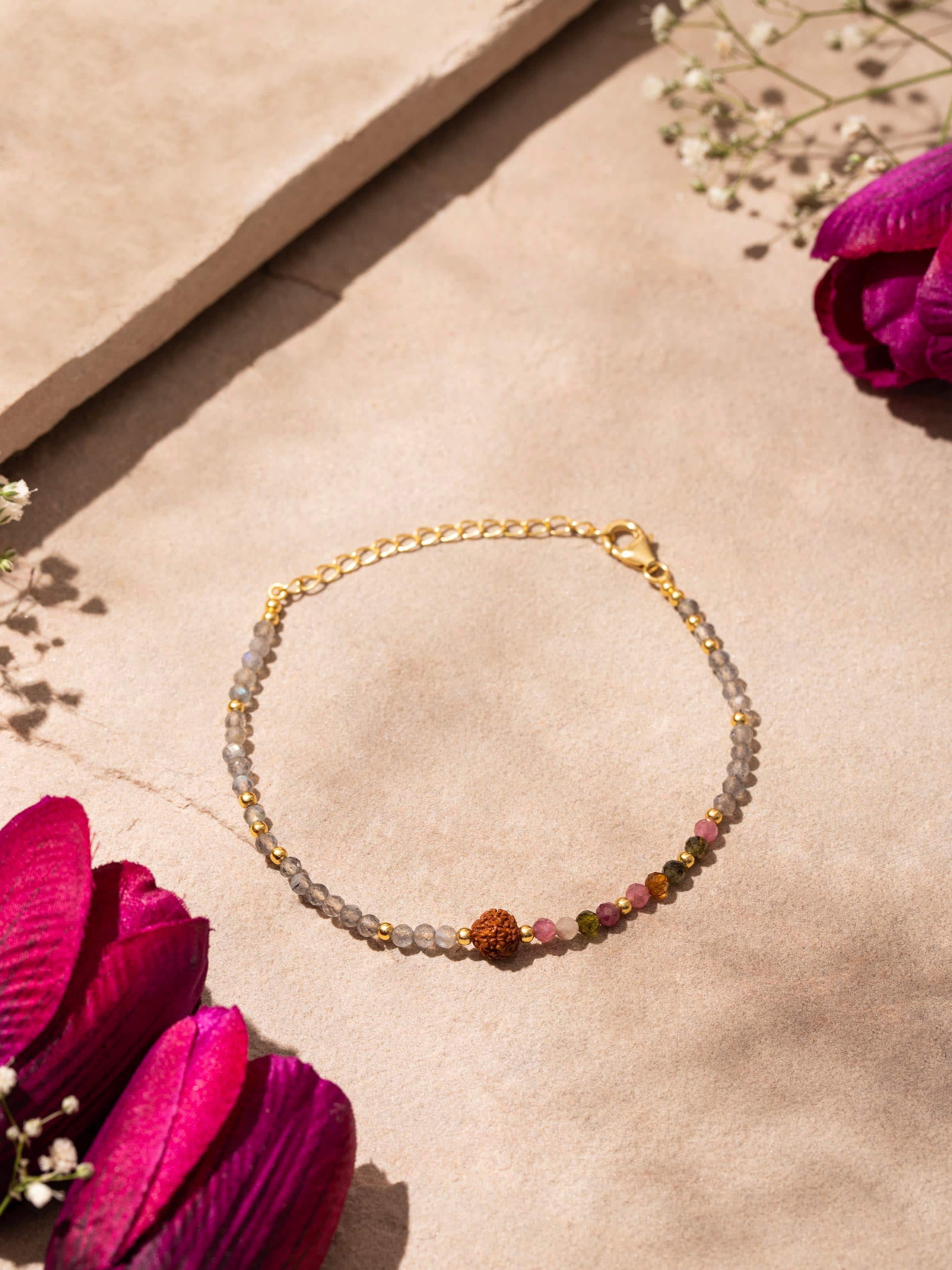 Side view of Labradorite, Tourmaline & Rudraksha Bracelet highlighting the 18K gold plating and gemstone details