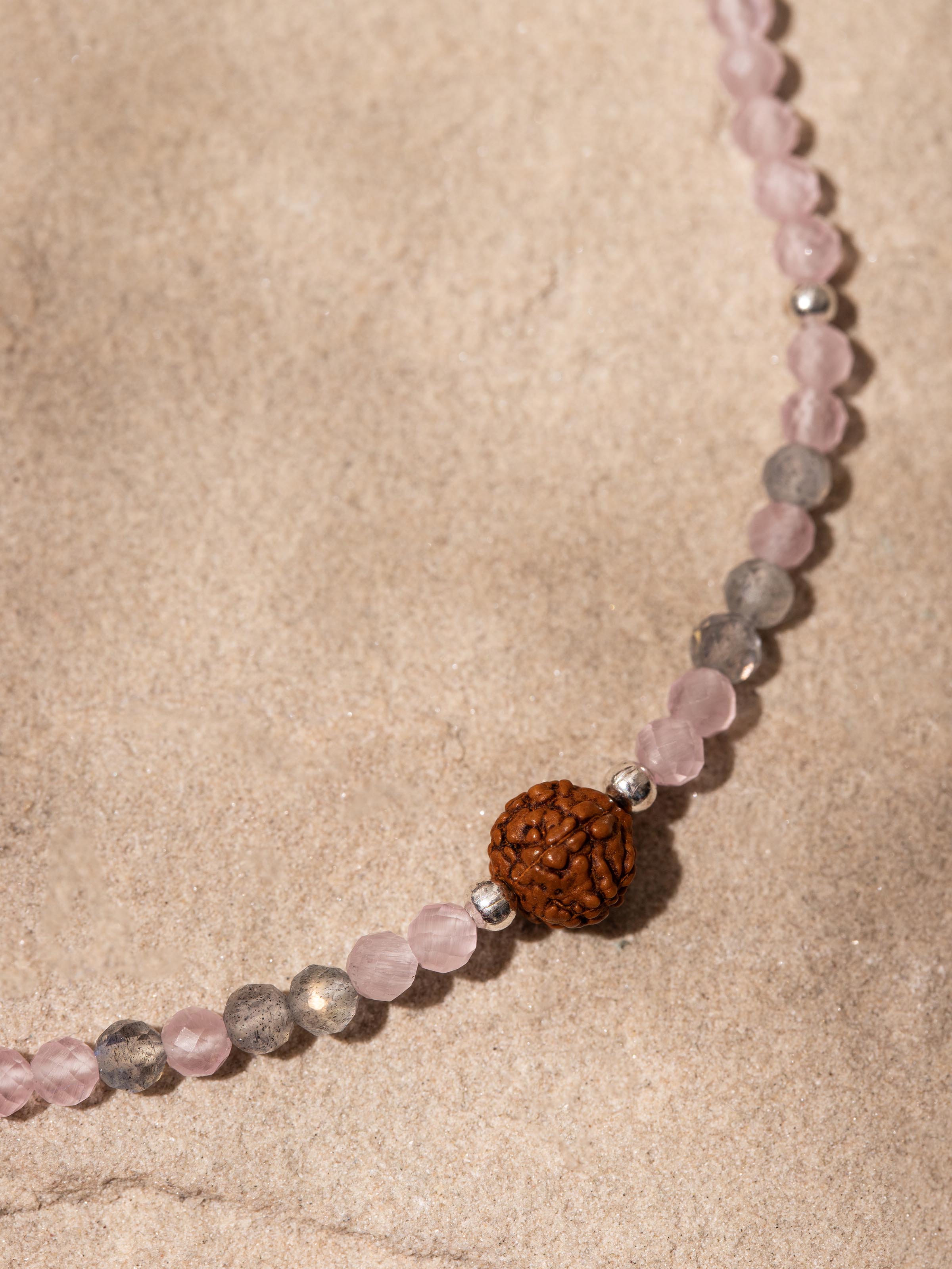 Detail shot of Rose Quartz, Labradorite & Rudraksha Sterling Silver Bracelet highlighting gemstone and silver details
