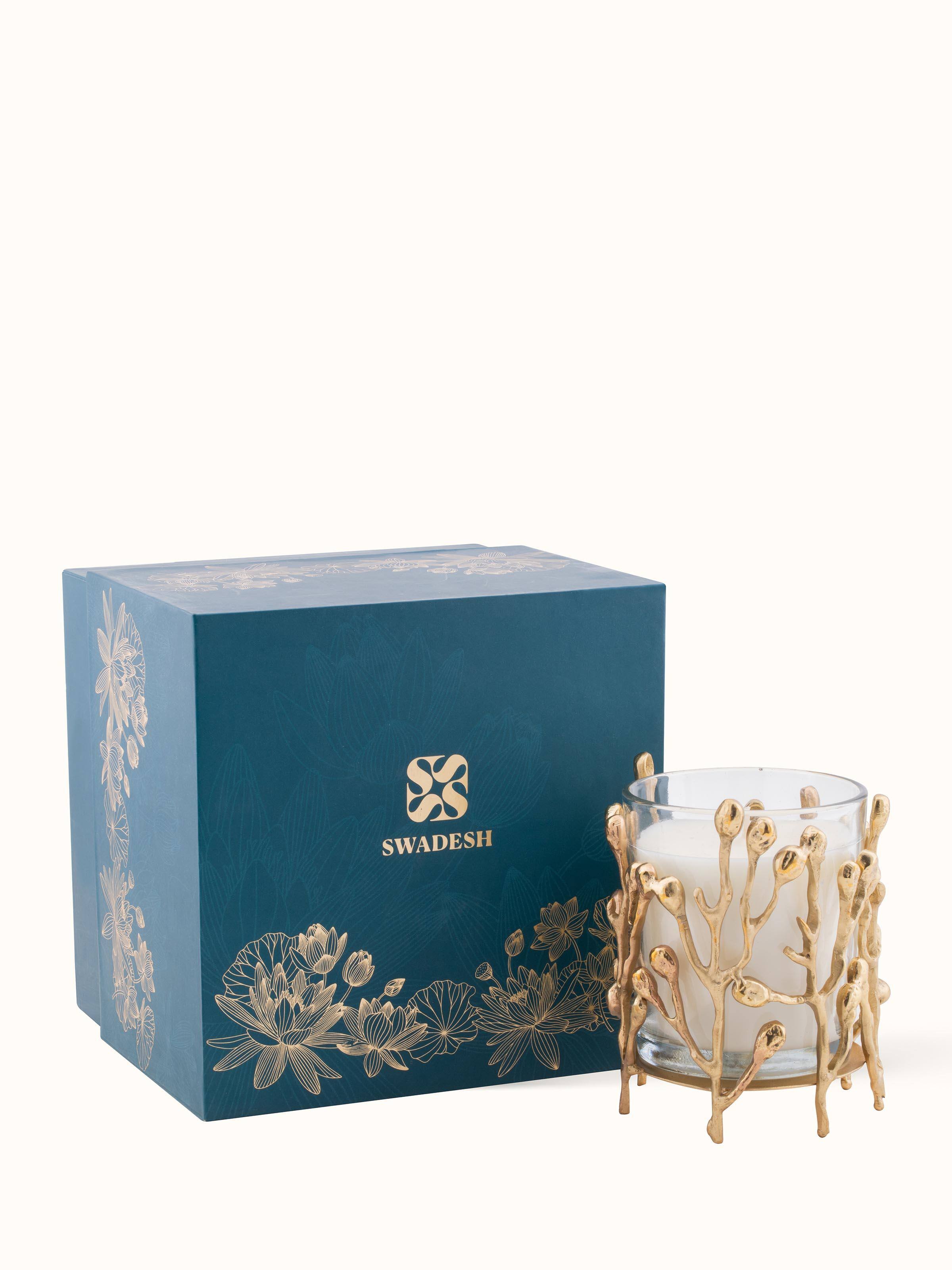 Angled view of Brass Candle (Small) highlighting the candle's form and shine.