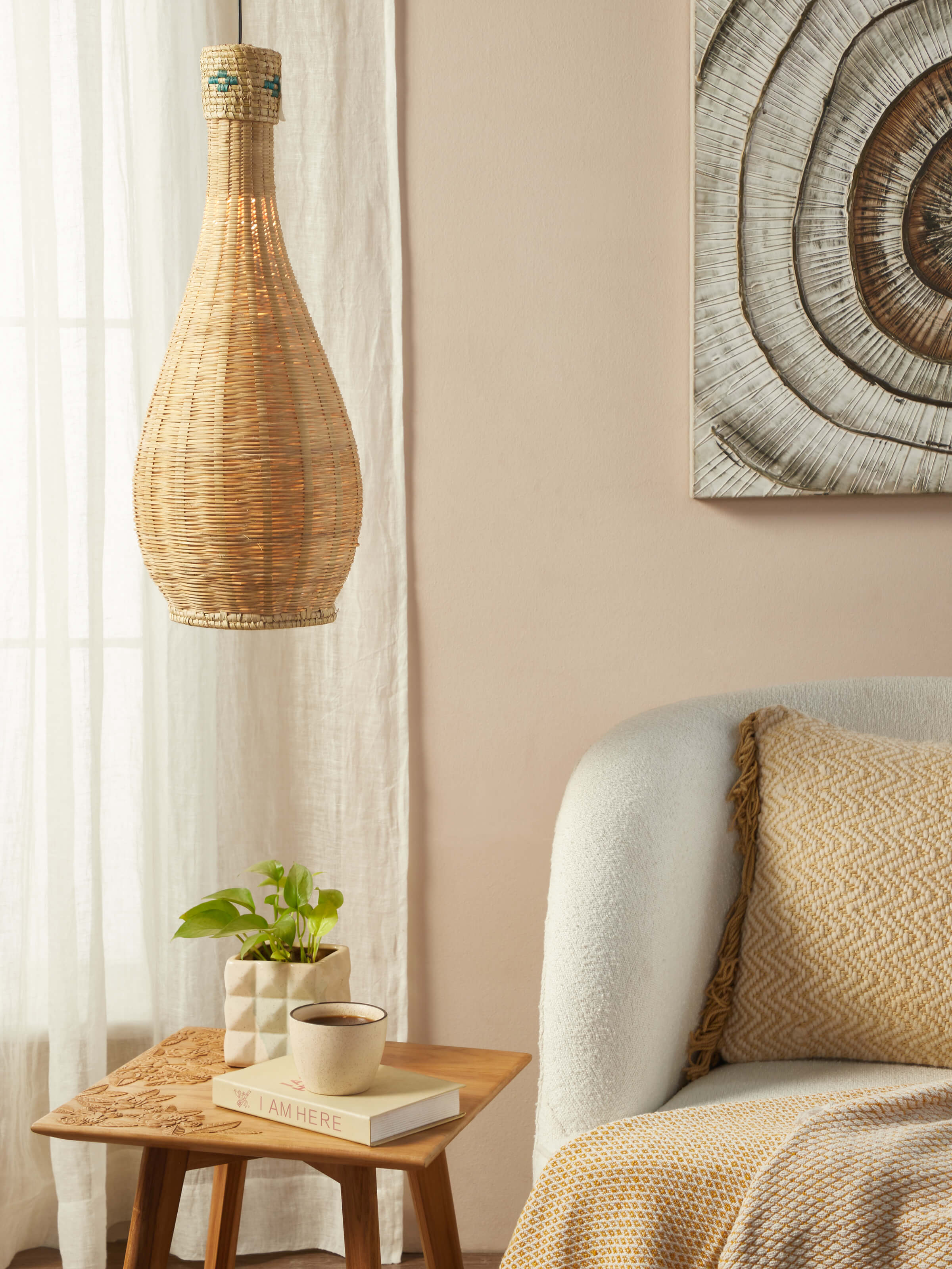 Side view of Kanshi Basketry Natural Fibre Pendant Light, highlighting the detailed basketry and unique design.
