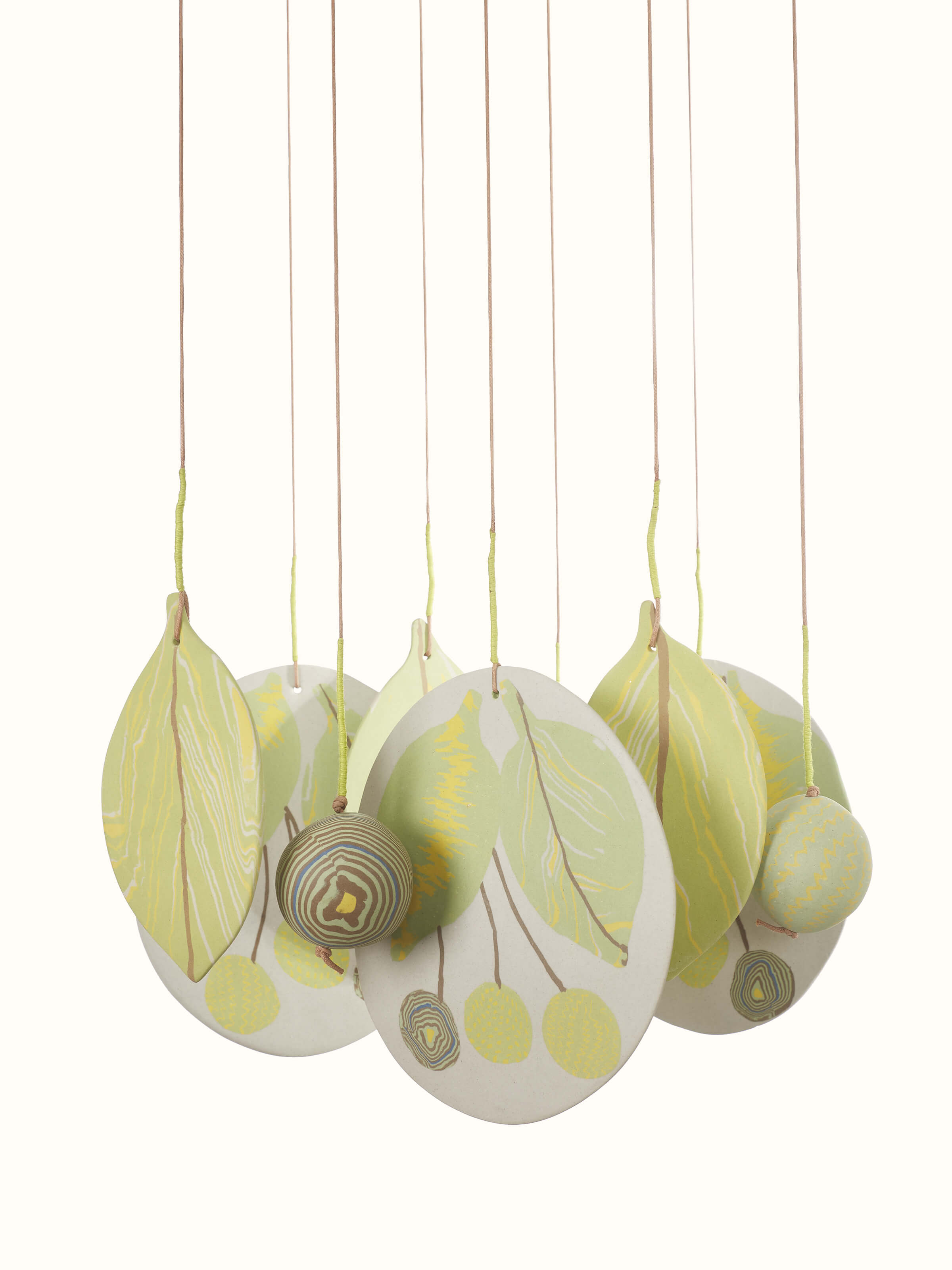 Angled view of Melodious Ceramicware Clay Wind Chime, showcasing its overall structure and hanging elements.