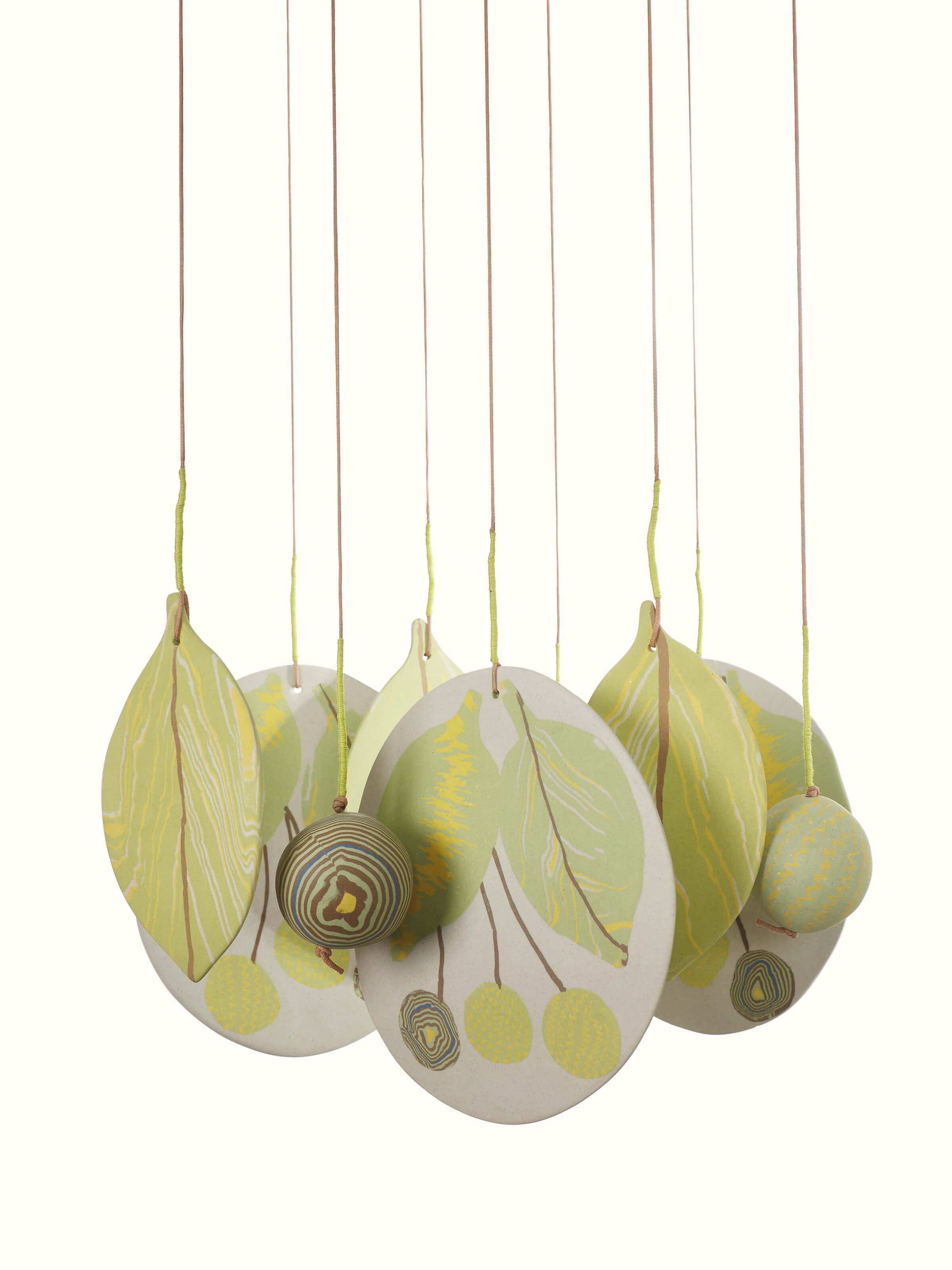 Detailed view of Melodious Ceramicware Clay Wind Chime, focusing on the craftsmanship and texture of the ceramic pieces.