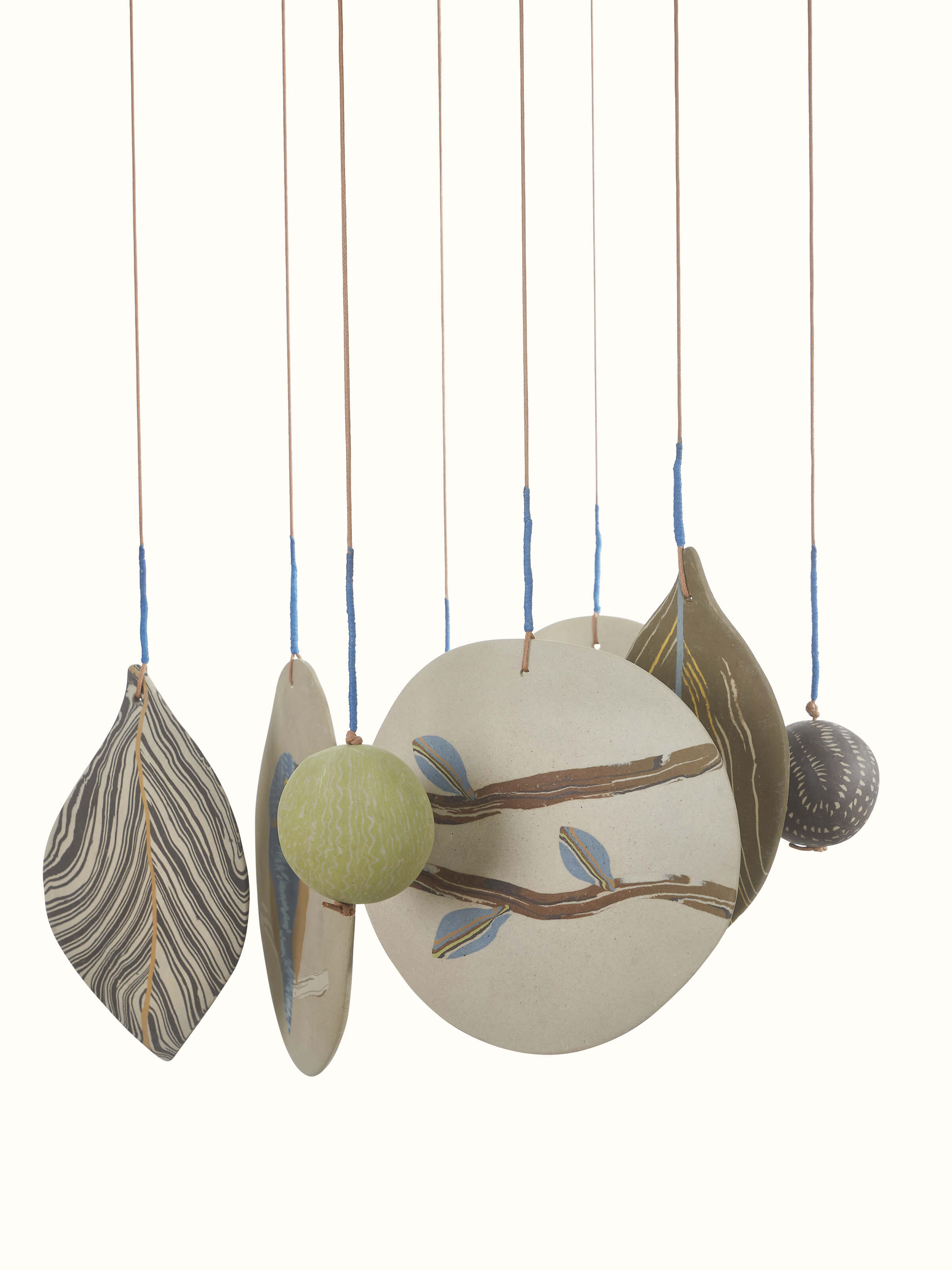 Detailed view of Whispering ceramicware clay wind chime with delicate wind-catching design