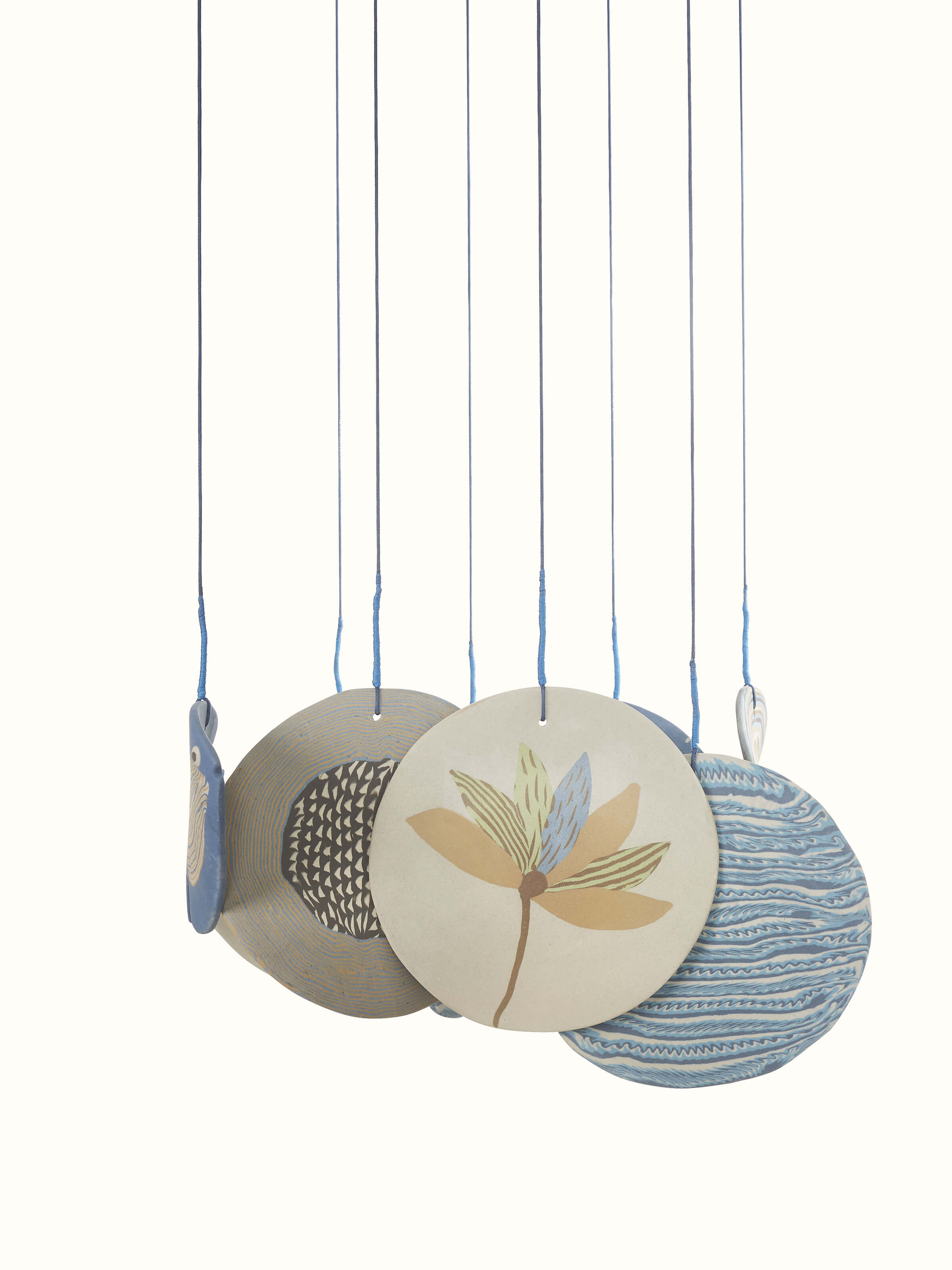 Ceramic wind chime showing its vibrant colors and intricate detailing in a close-up view.