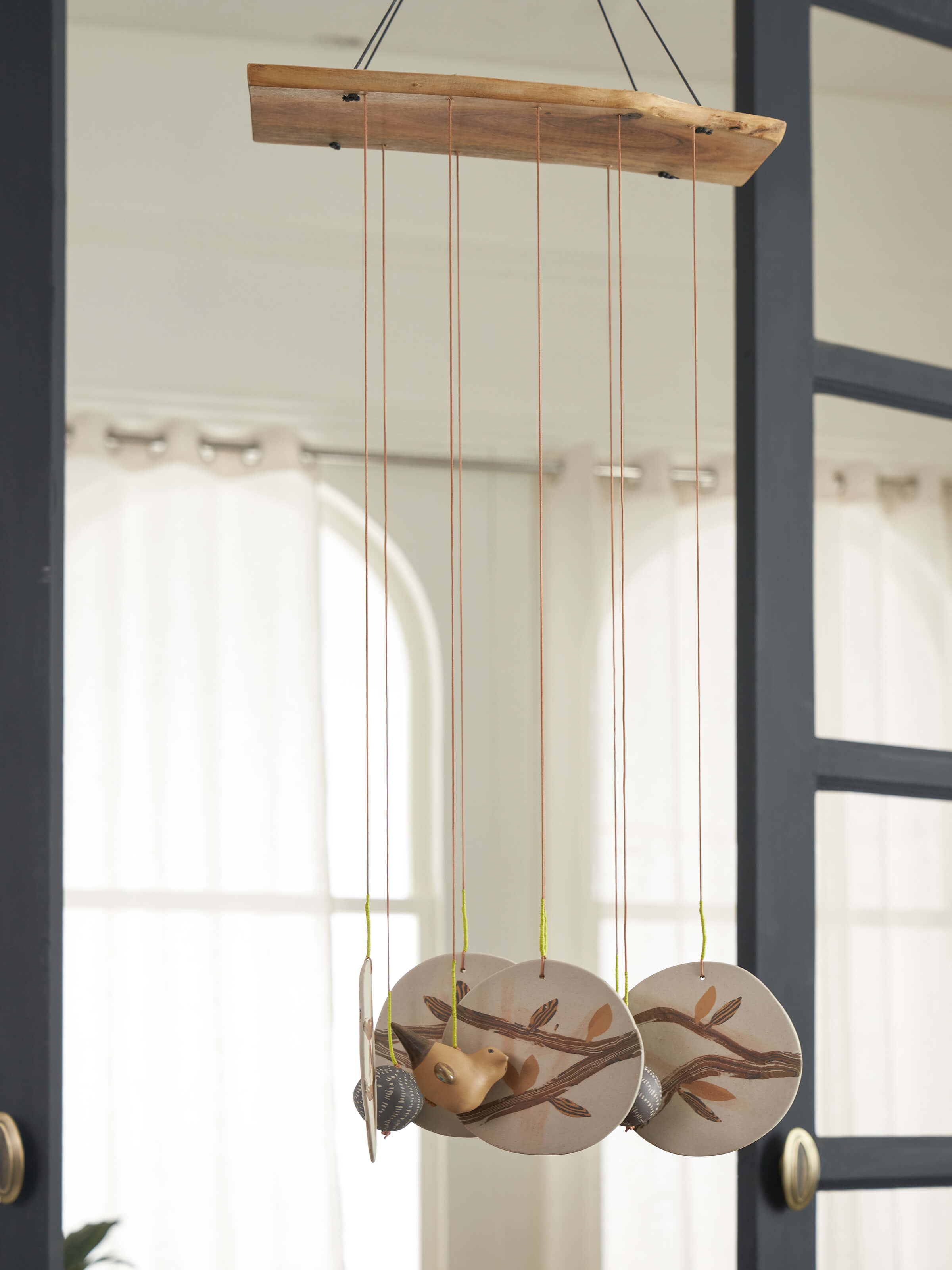 Side view of Matte ceramicware clay wind chime