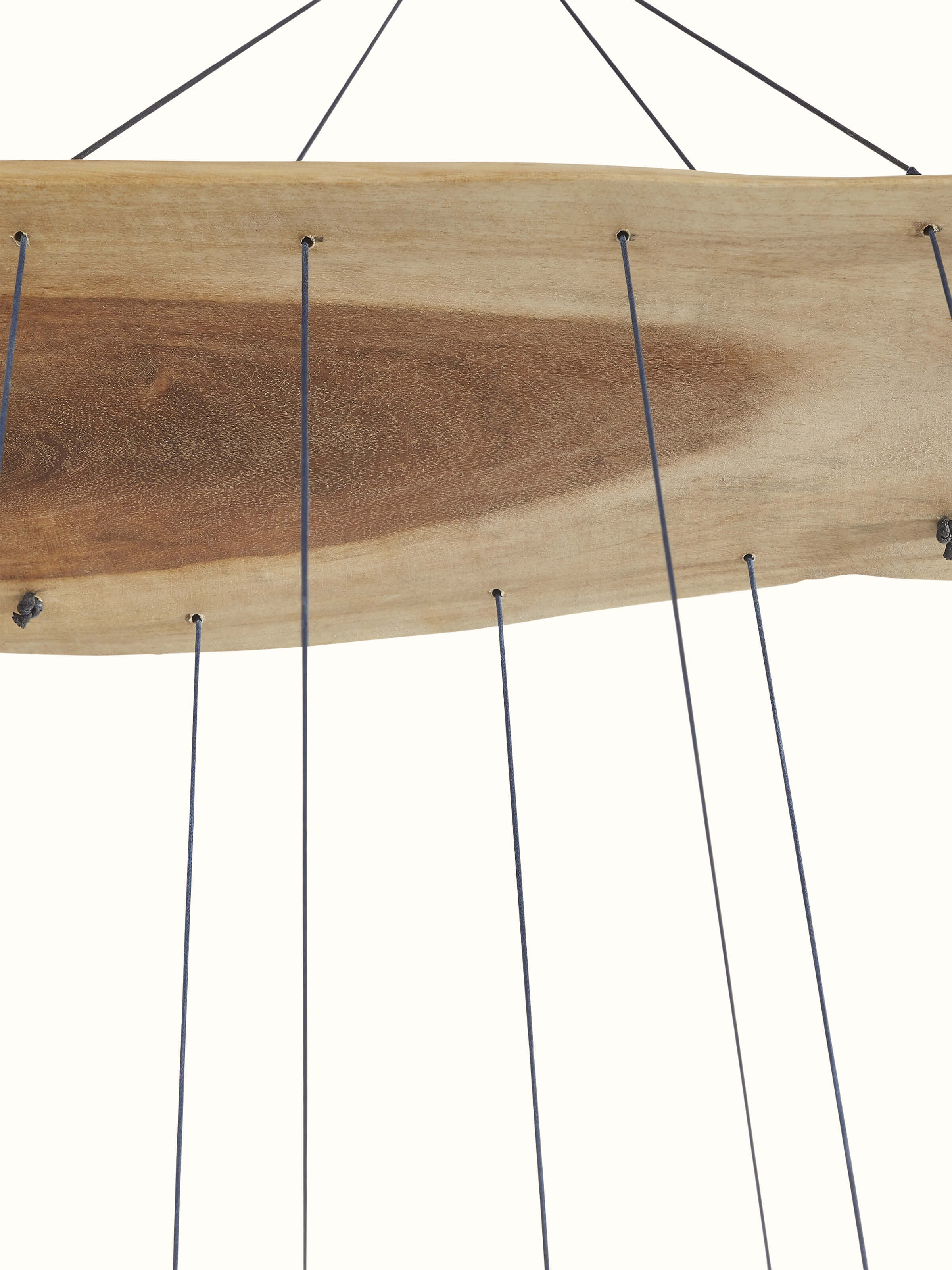 Angled view of Resonant Ceramicware Clay Wind Chime emphasizing its unique texture and color