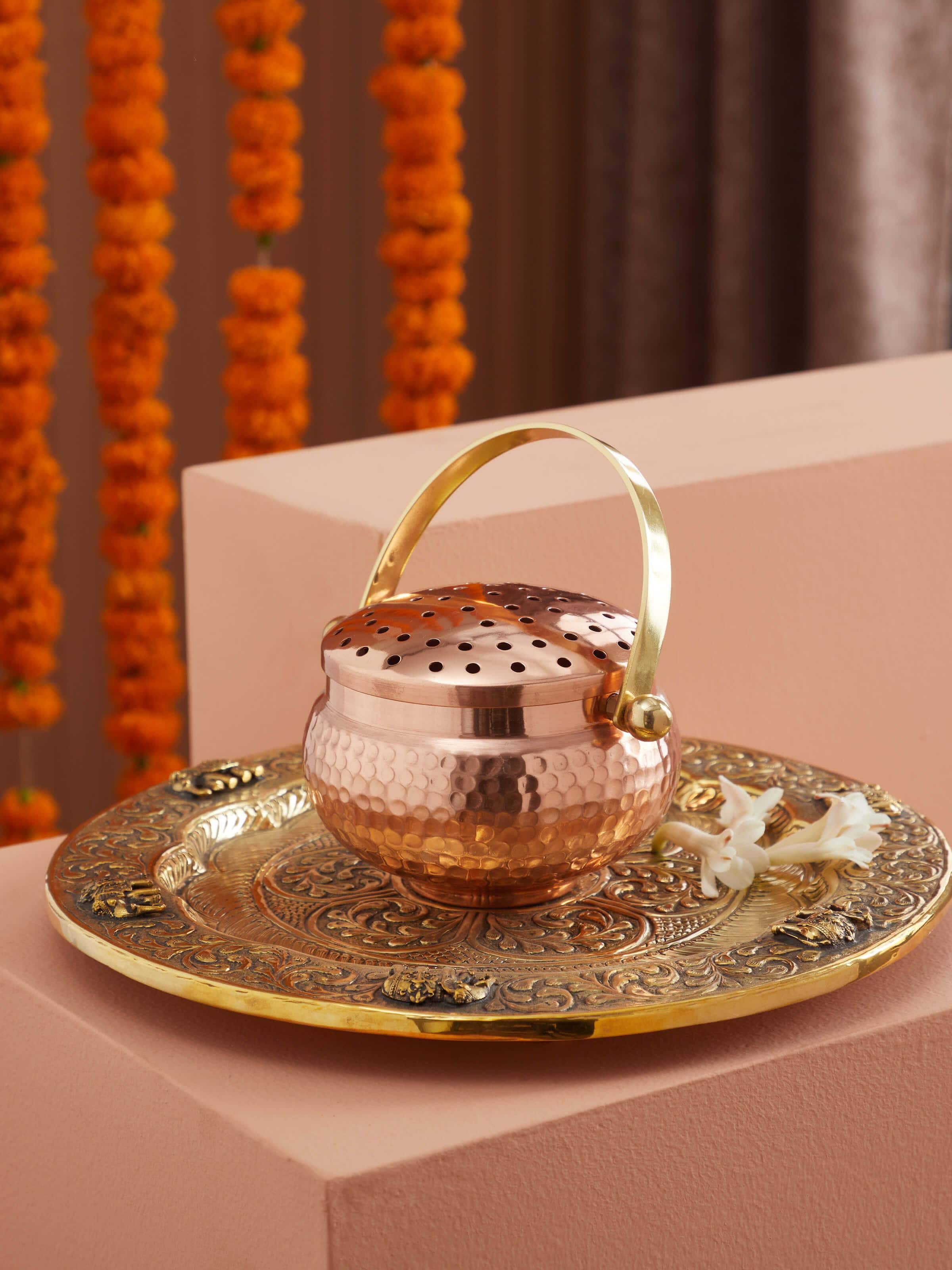 Side view of Polished copperware dhuna small