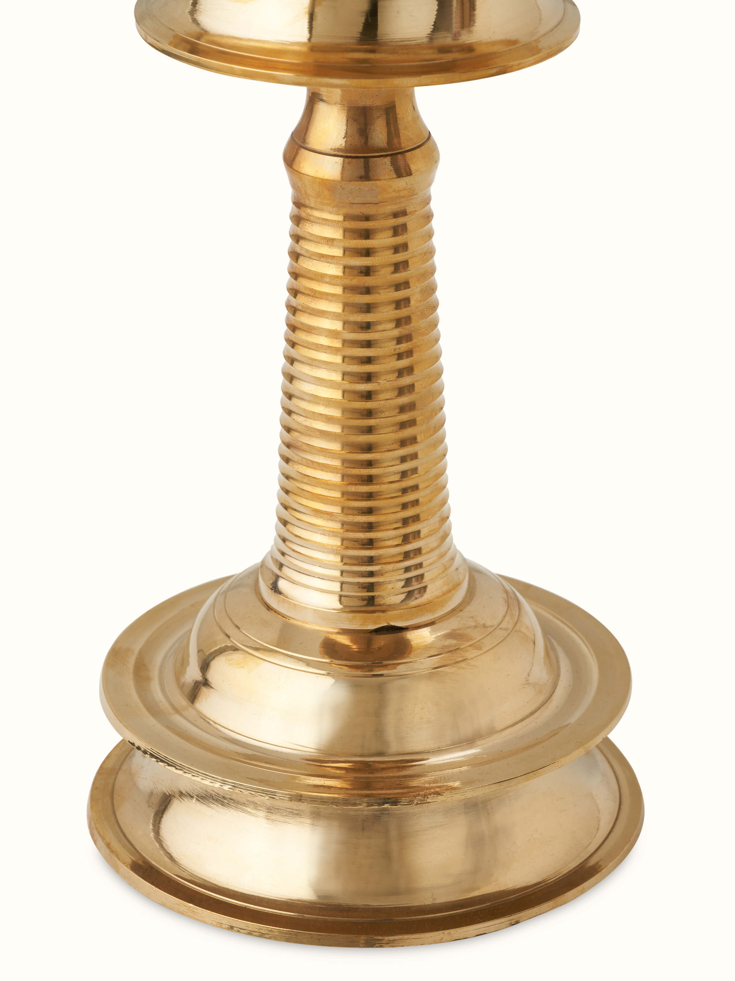 Close-up view of Brass Kuthu Vilakku Stand Diya, focusing on its detailed metalwork and finish
