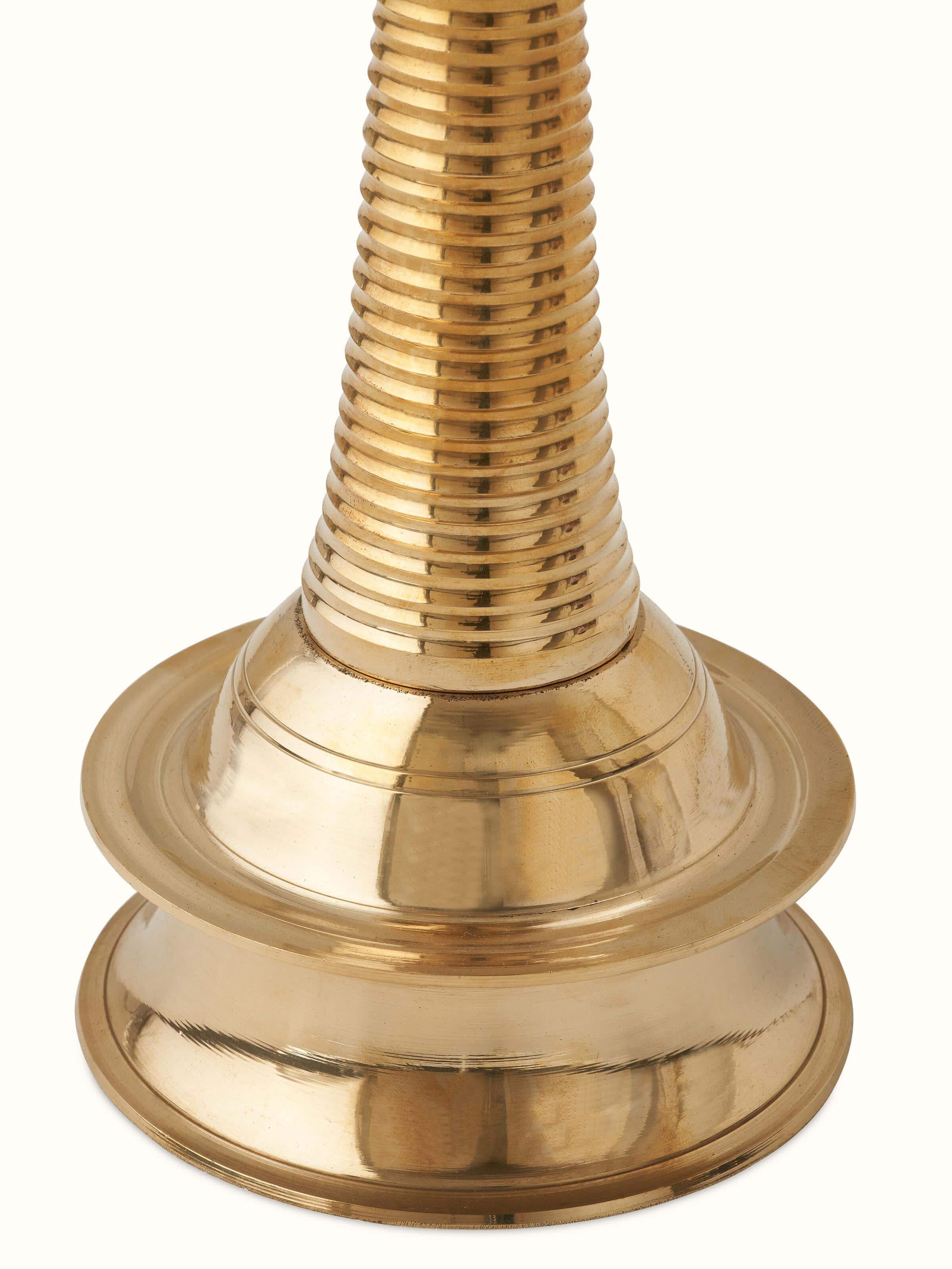 Full view of brass kuthu vilakku stand diya, highlighting its detailed artwork and traditional style.