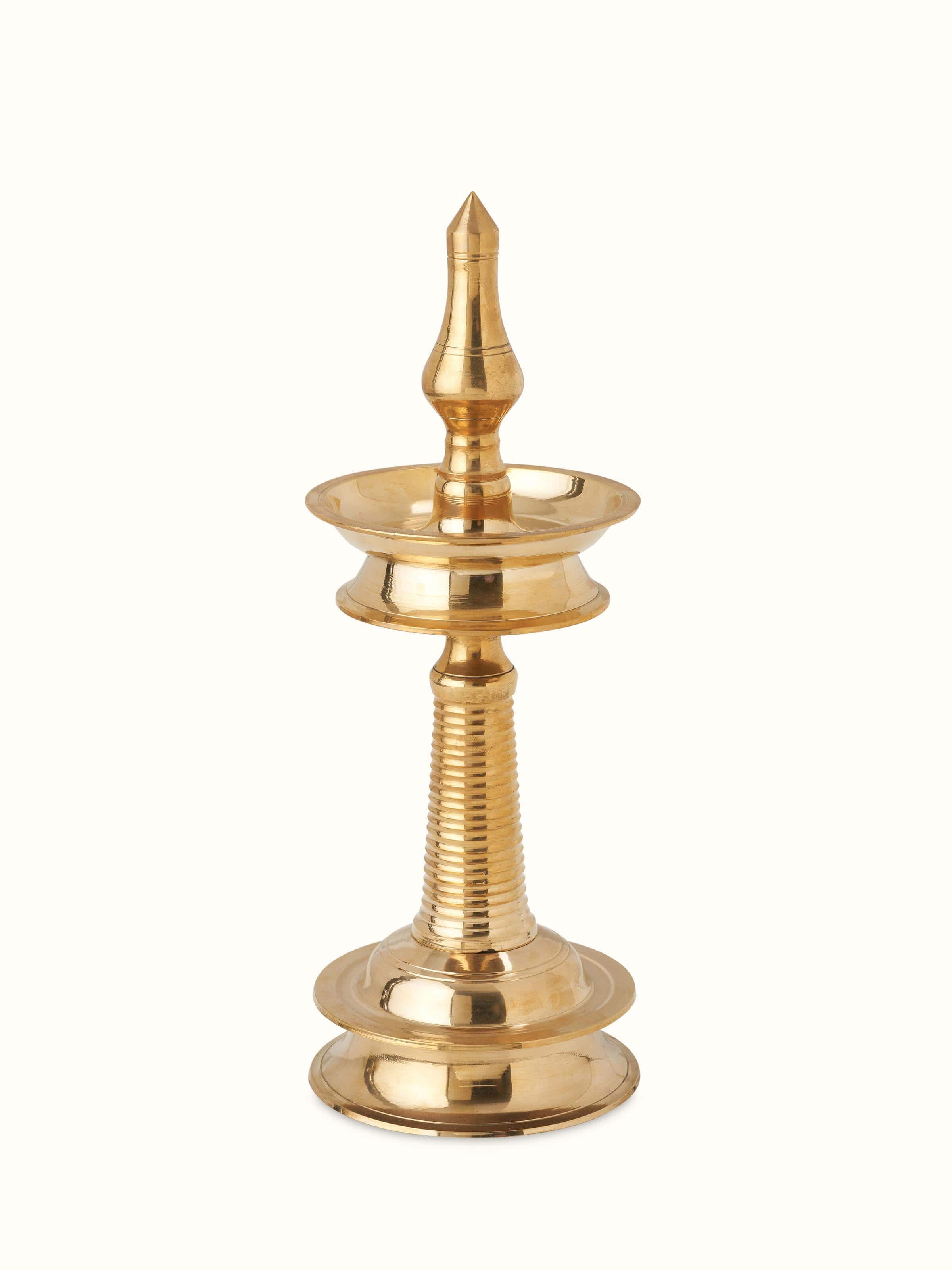 Front view of brass-plated kuthu vilakku stand diya with intricate detailing