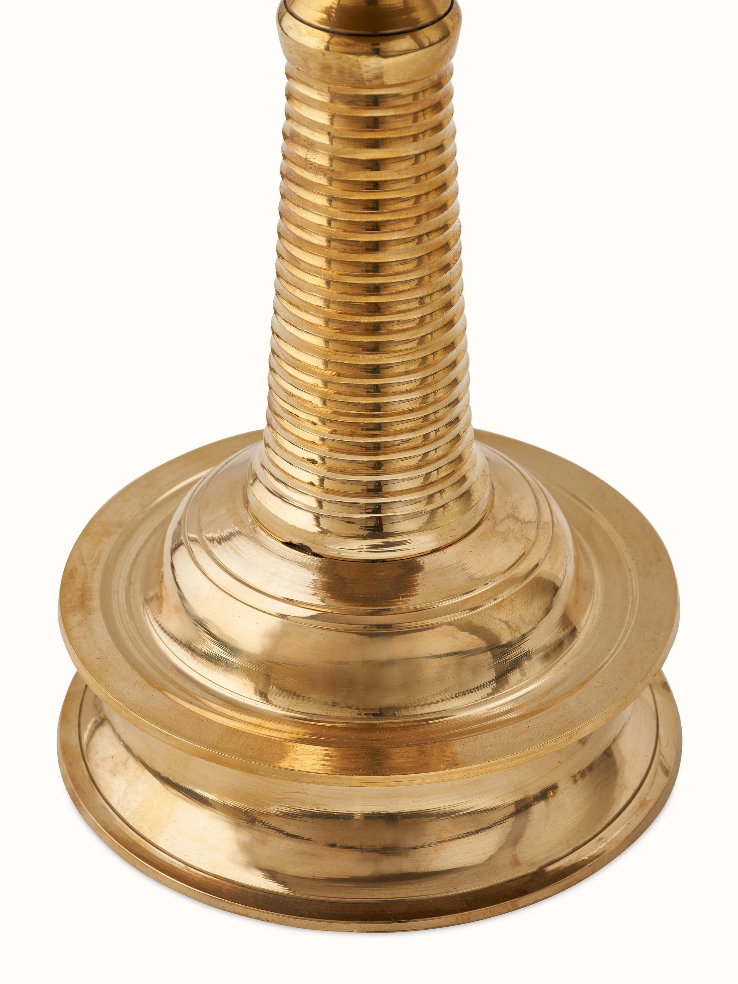 Front view of brass-plated kuthu vilakku stand diya highlighting fine details