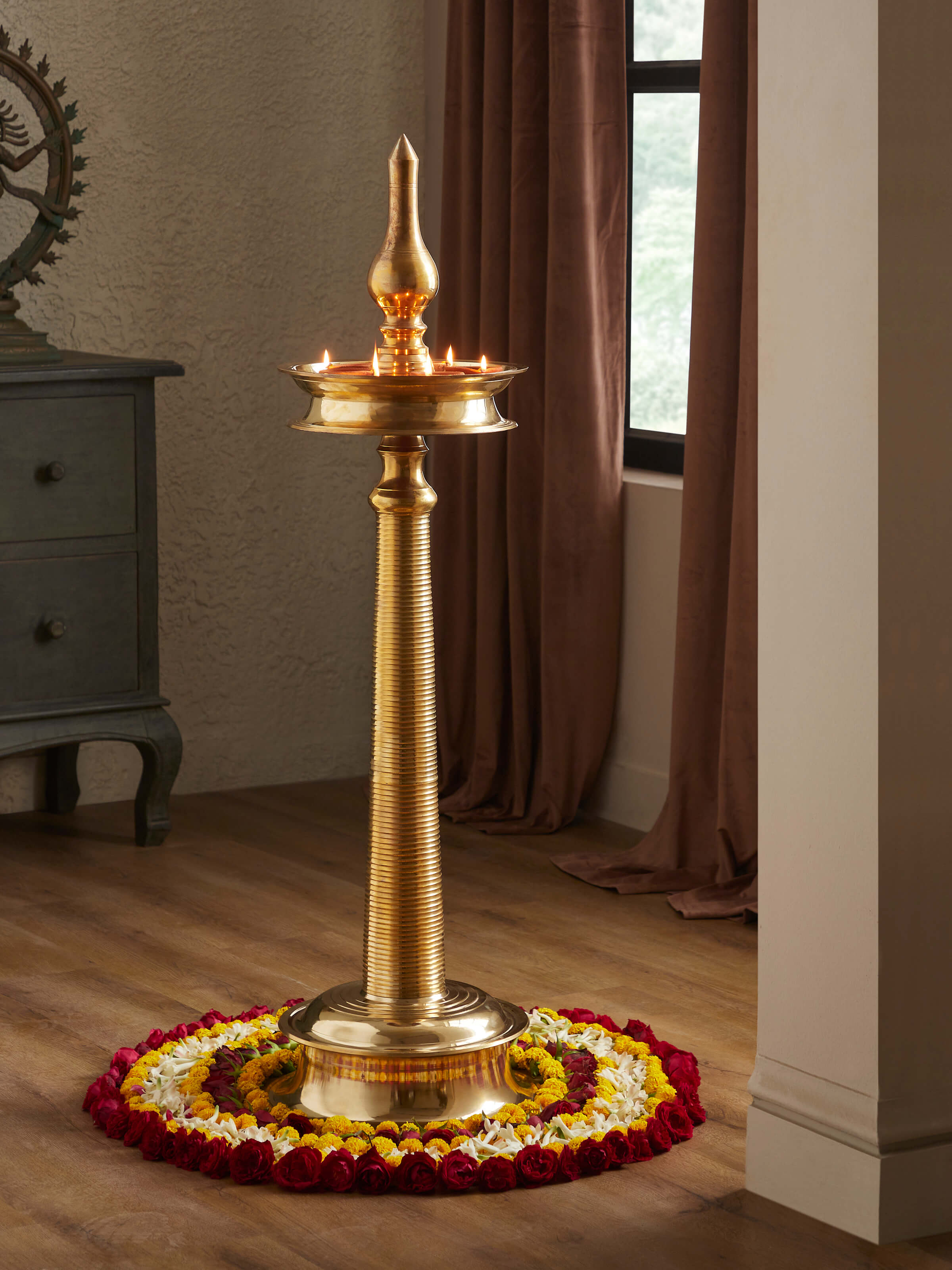 Close-up detail of Brass-Plated Samai Vilakku Stand Diya highlighting the intricate patterns and brass finish.