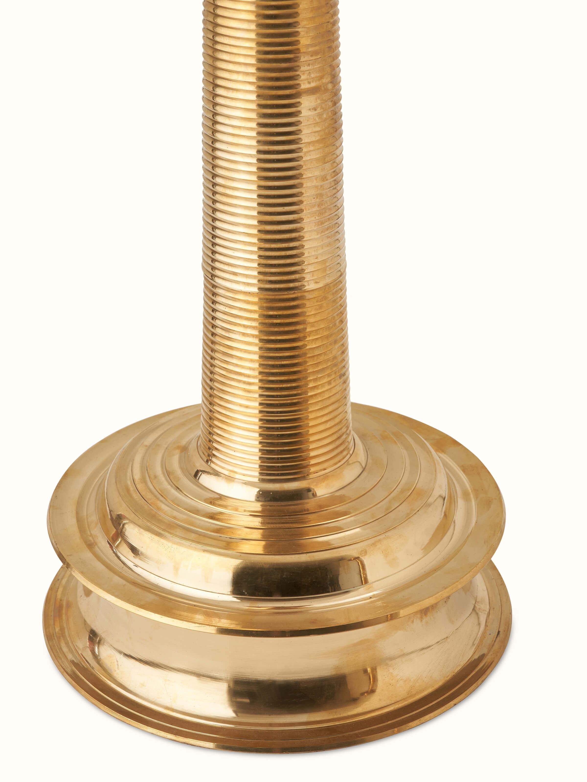 Side view of decorative brass samai vilakku stand diya, emphasizing the intricate design and craftsmanship.