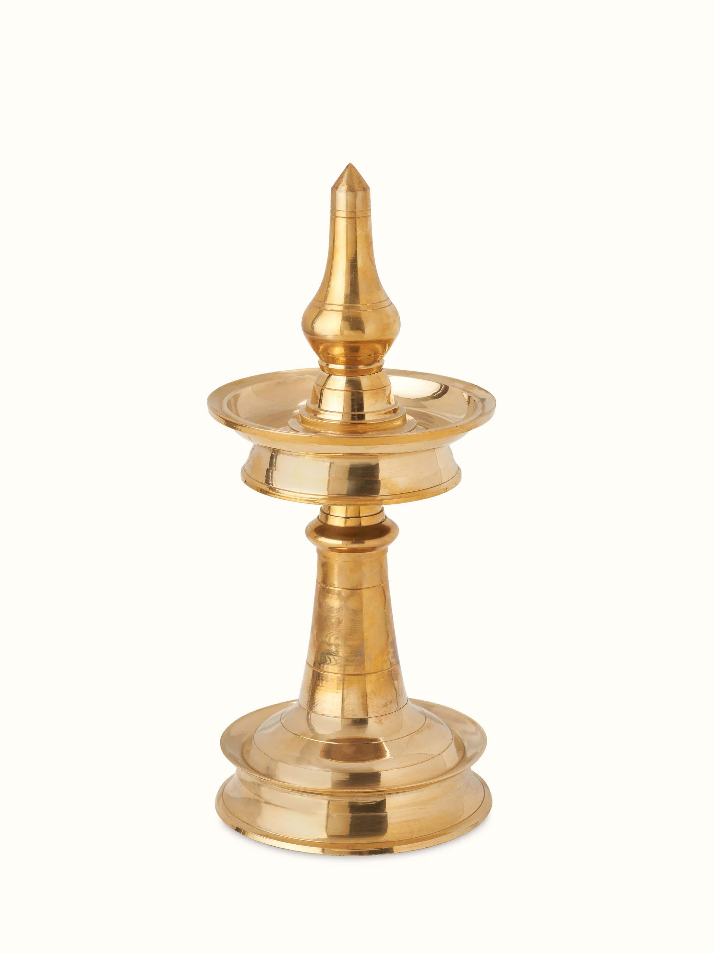 Front view of Traditional brass samai vilakku stand diya with detailed design