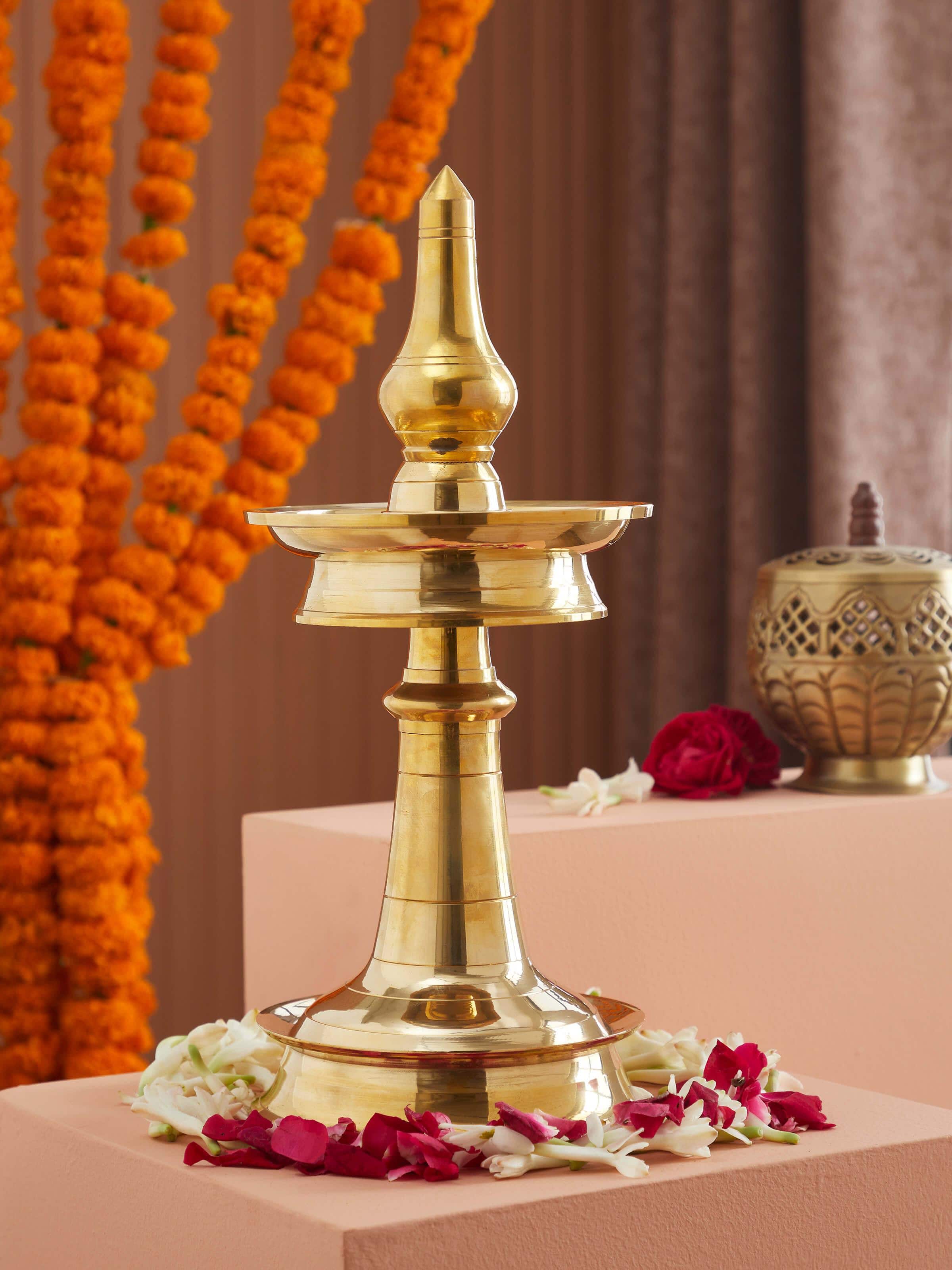 Side view of Traditional brass samai vilakku stand diya showcasing its intricate craftsmanship