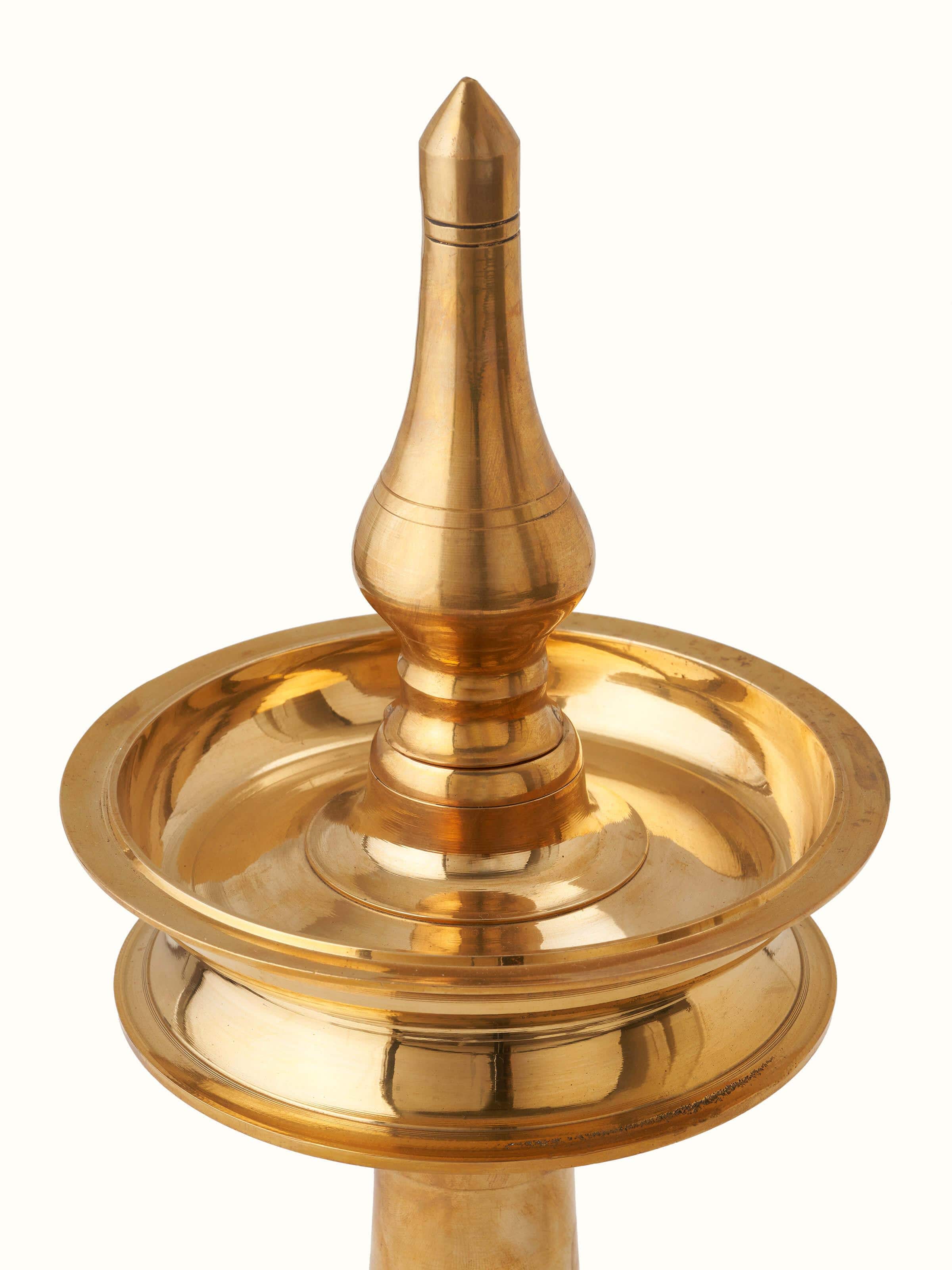 Close-up of Polished Brass-Plated Samai Vilakku Stand Diya focusing on intricate designs