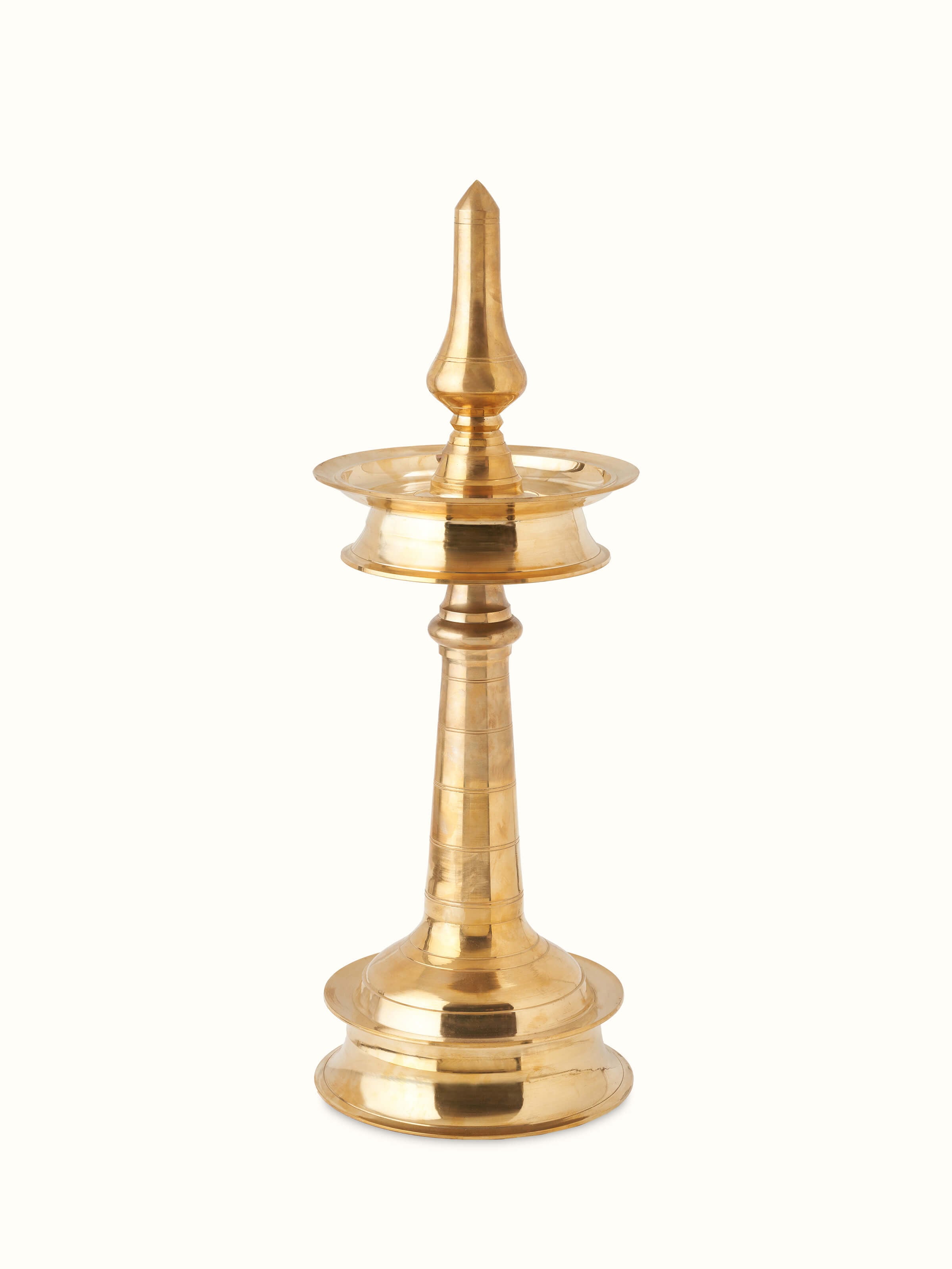 Detailed view of brass samai vilakku stand diya, showcasing its traditional design and polished finish.