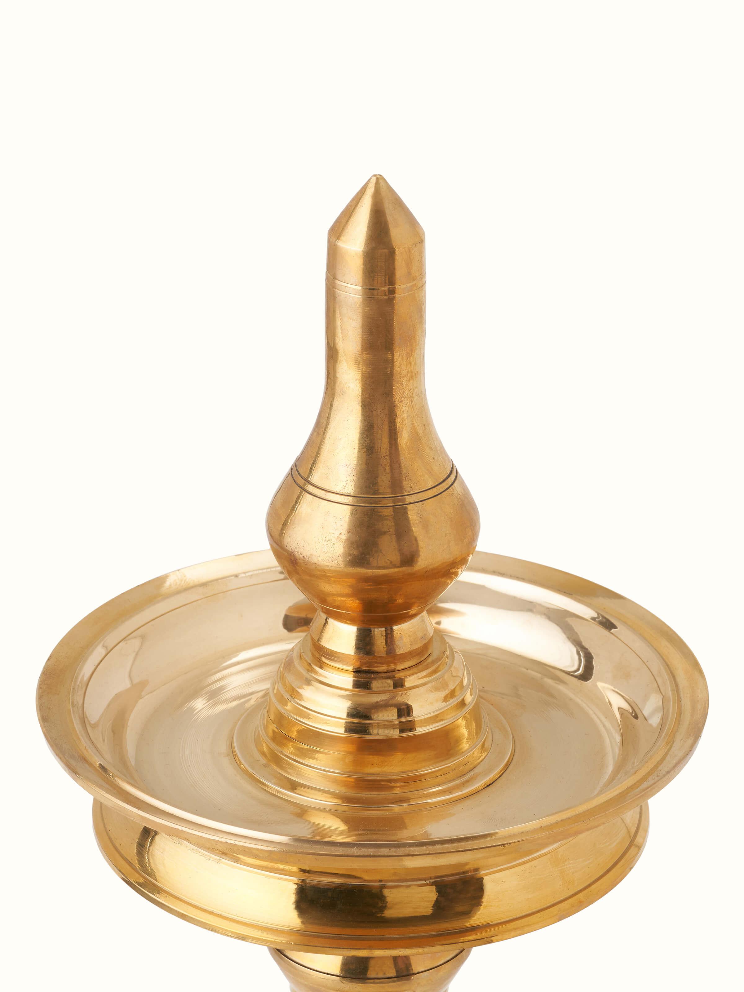 Detailed view of Brass-Plated Samai Vilakku Stand Diya highlighting its craftsmanship.