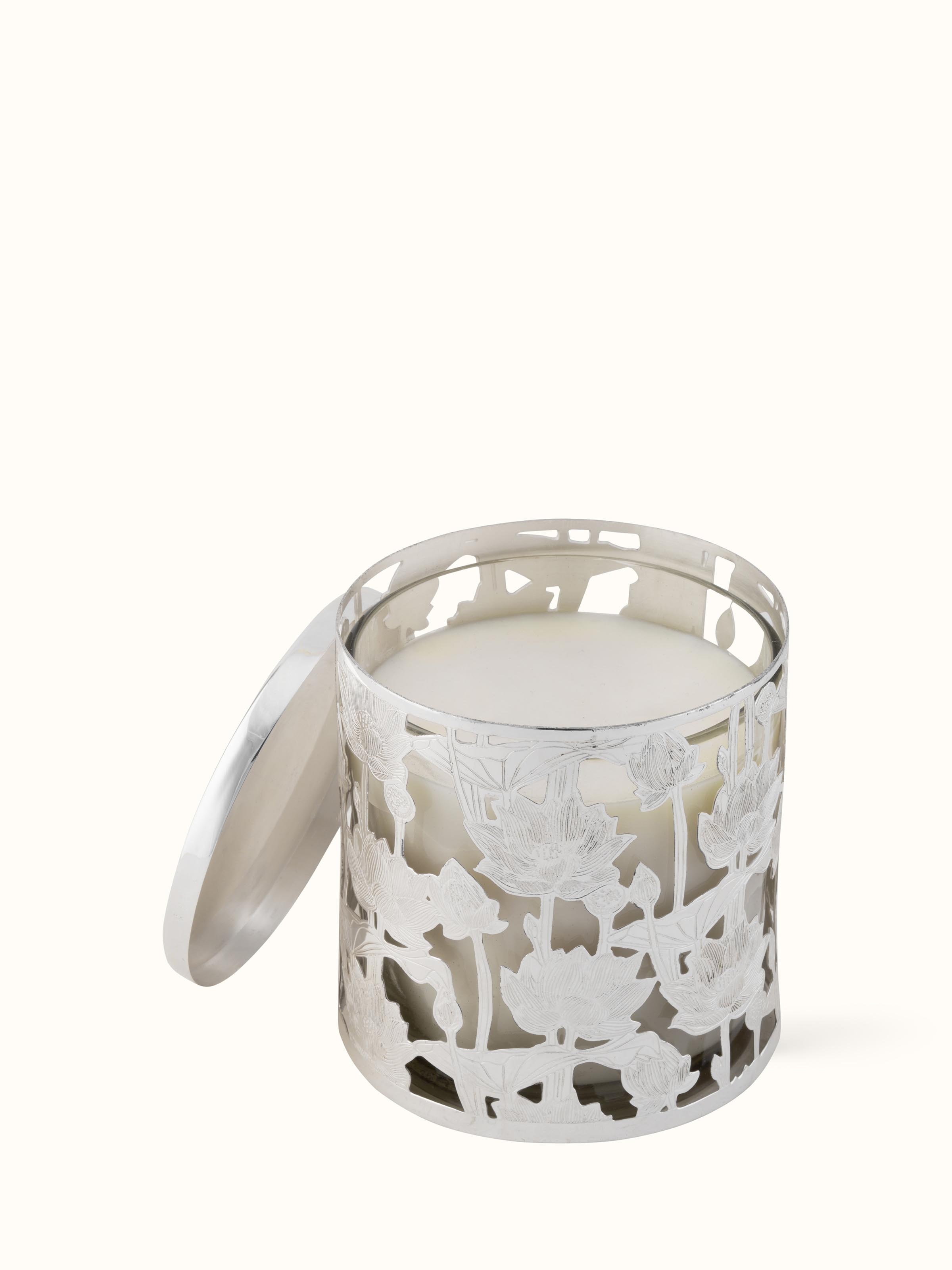 Front view of elegant silver-plated brass candle holder featuring detailed craftsmanship.