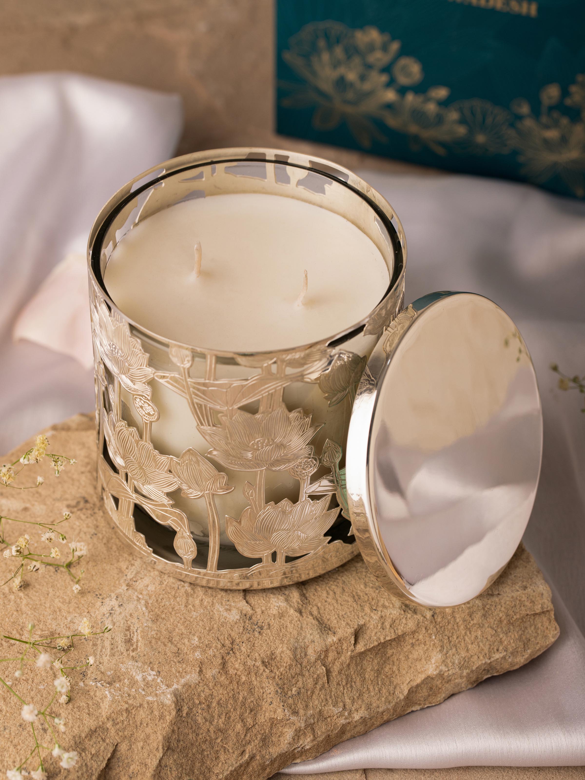 Close-up view of detailed design on silver-plated brass candle holder with intricate patterns.