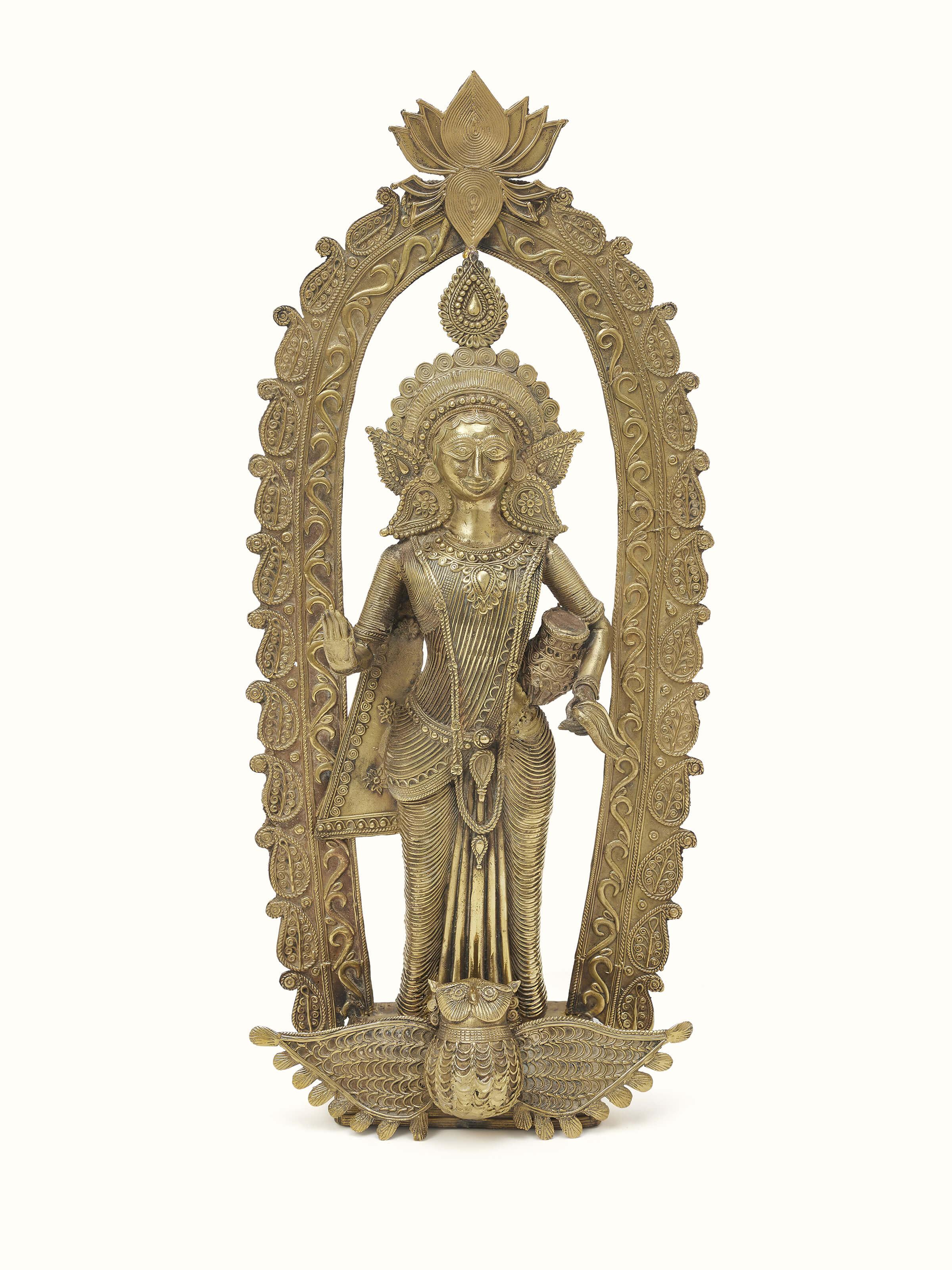 Front view of Vasudha dhokra brass Lakshmi idol, highlighting the craftsmanship and details.