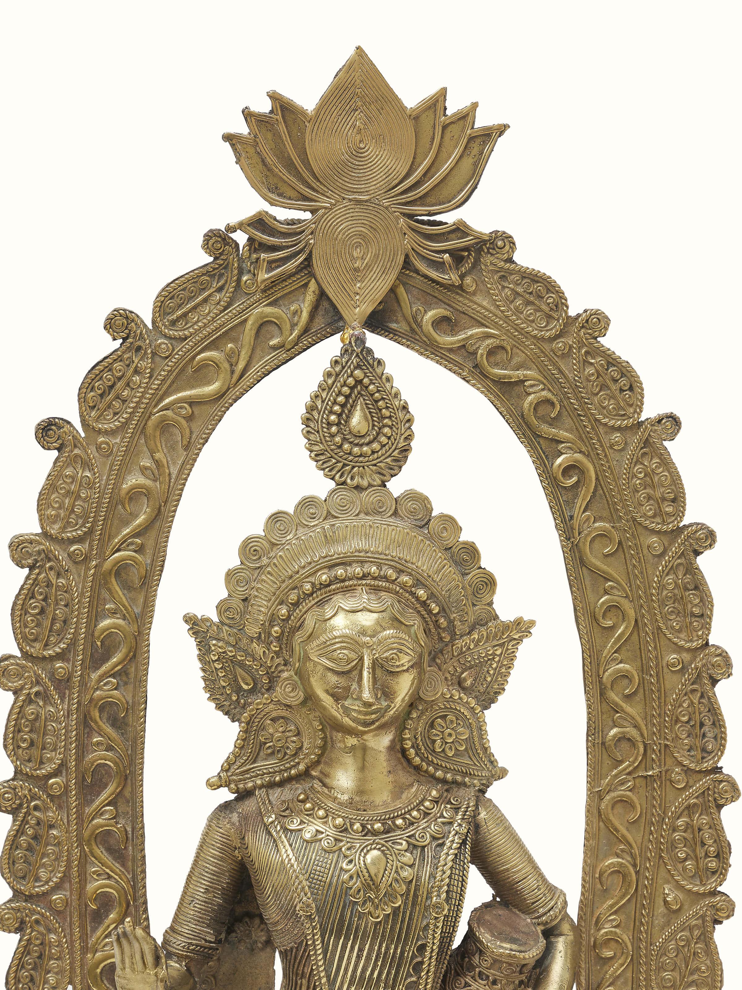 Detailed view of Vasudha dhokra brass Lakshmi idol, showcasing the fine brass work.