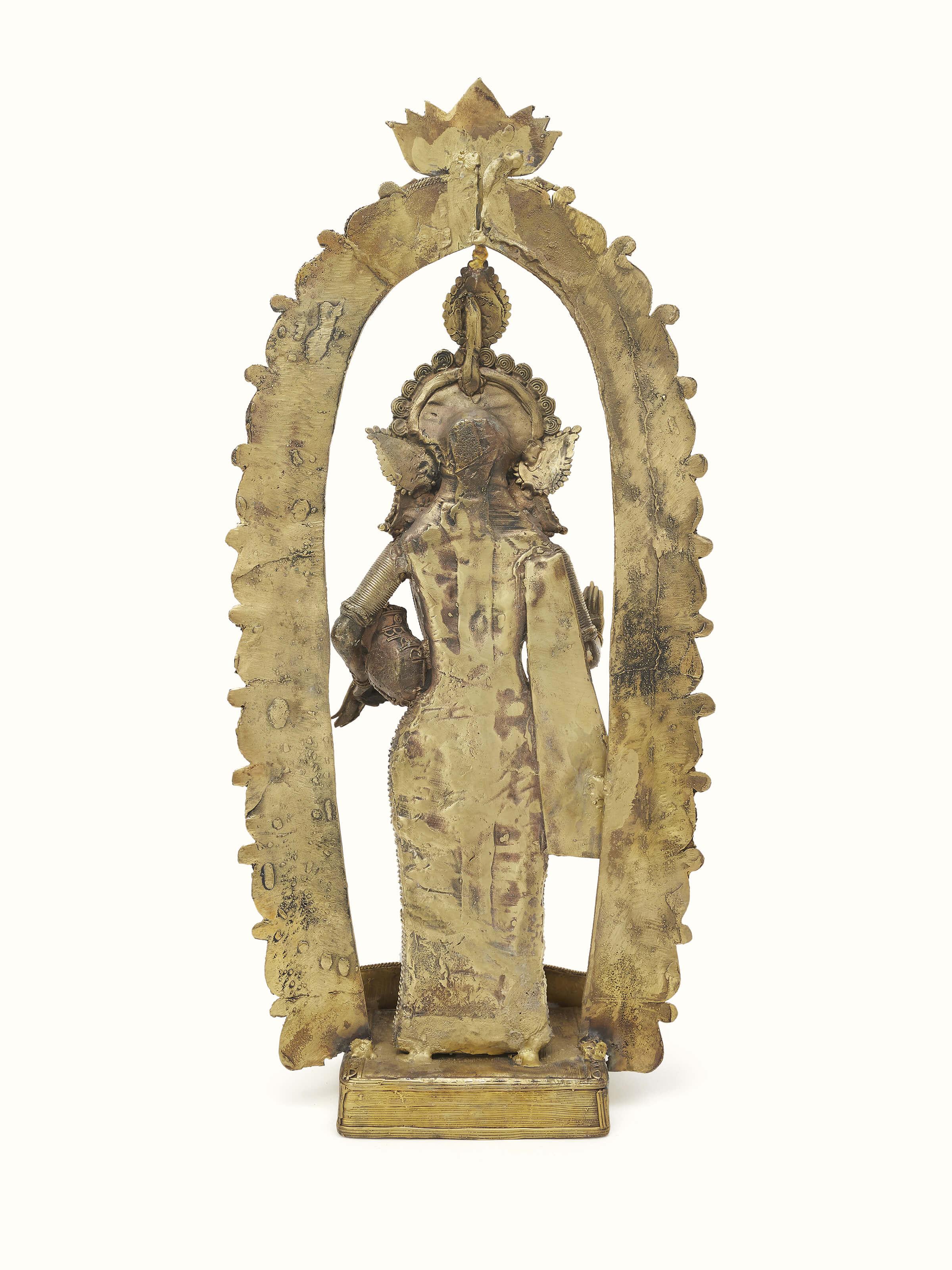 Artistic view of Vasudha dhokra brass Lakshmi idol, emphasizing the intricate design.