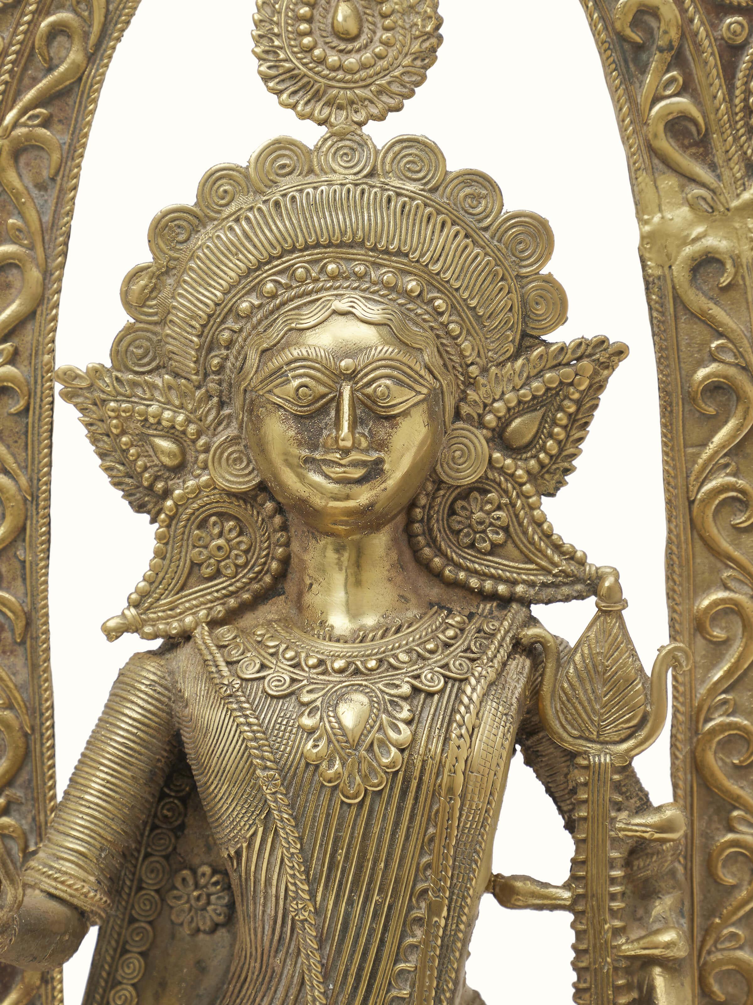 Dhokra Saraswati Brass Idol from an angle emphasizing the detailed sculpture and texture