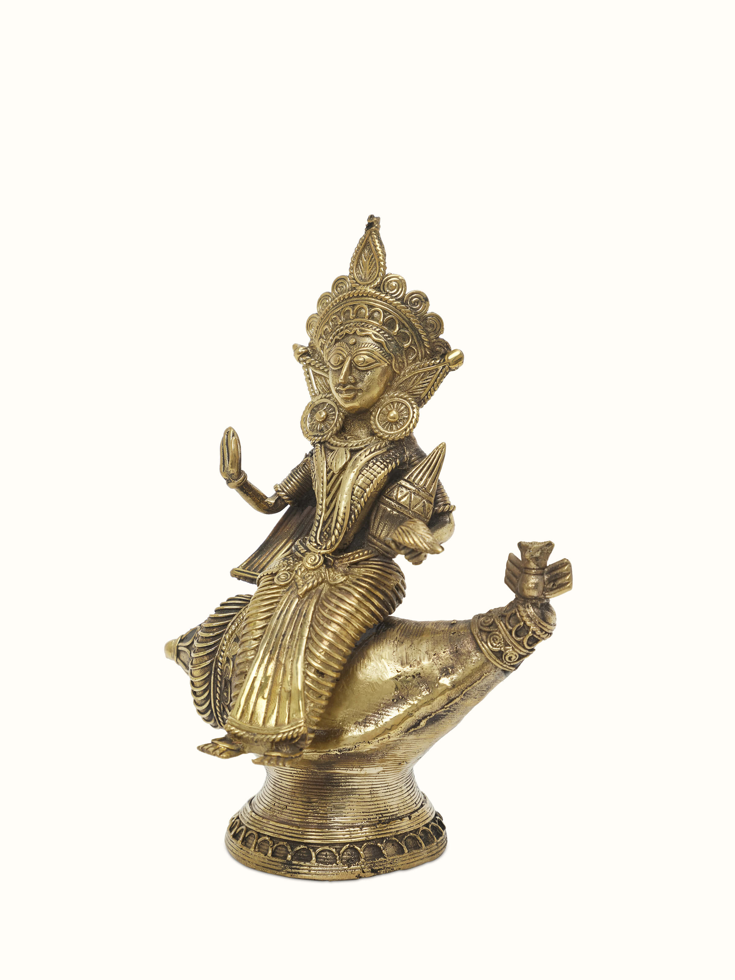 Close-up view of Vishnupatni dhokra brass Lakshmi on conch shell idol highlighting intricate details