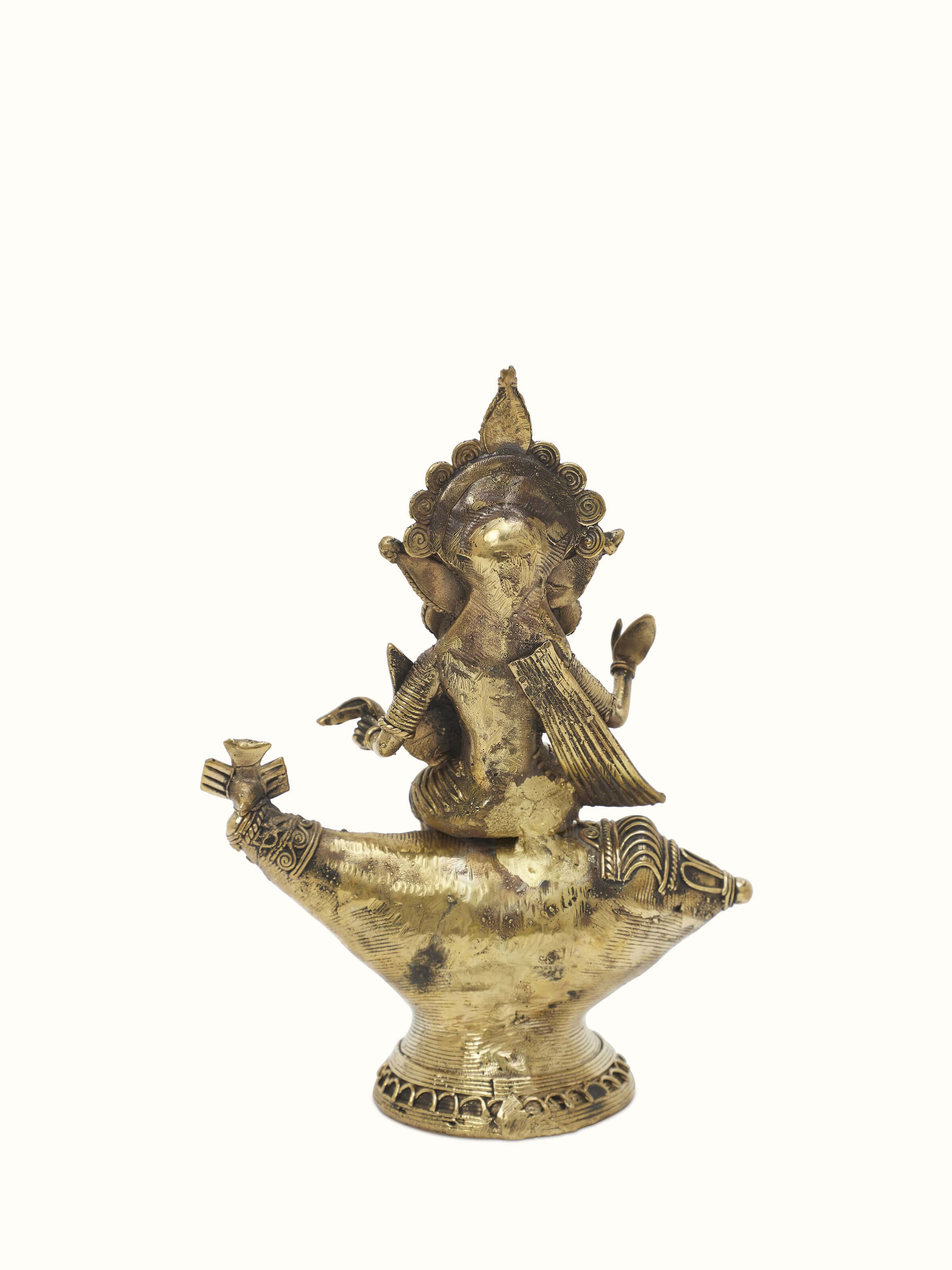 Detailed view of Vishnupatni dhokra brass Lakshmi on conch shell idol with ornate design