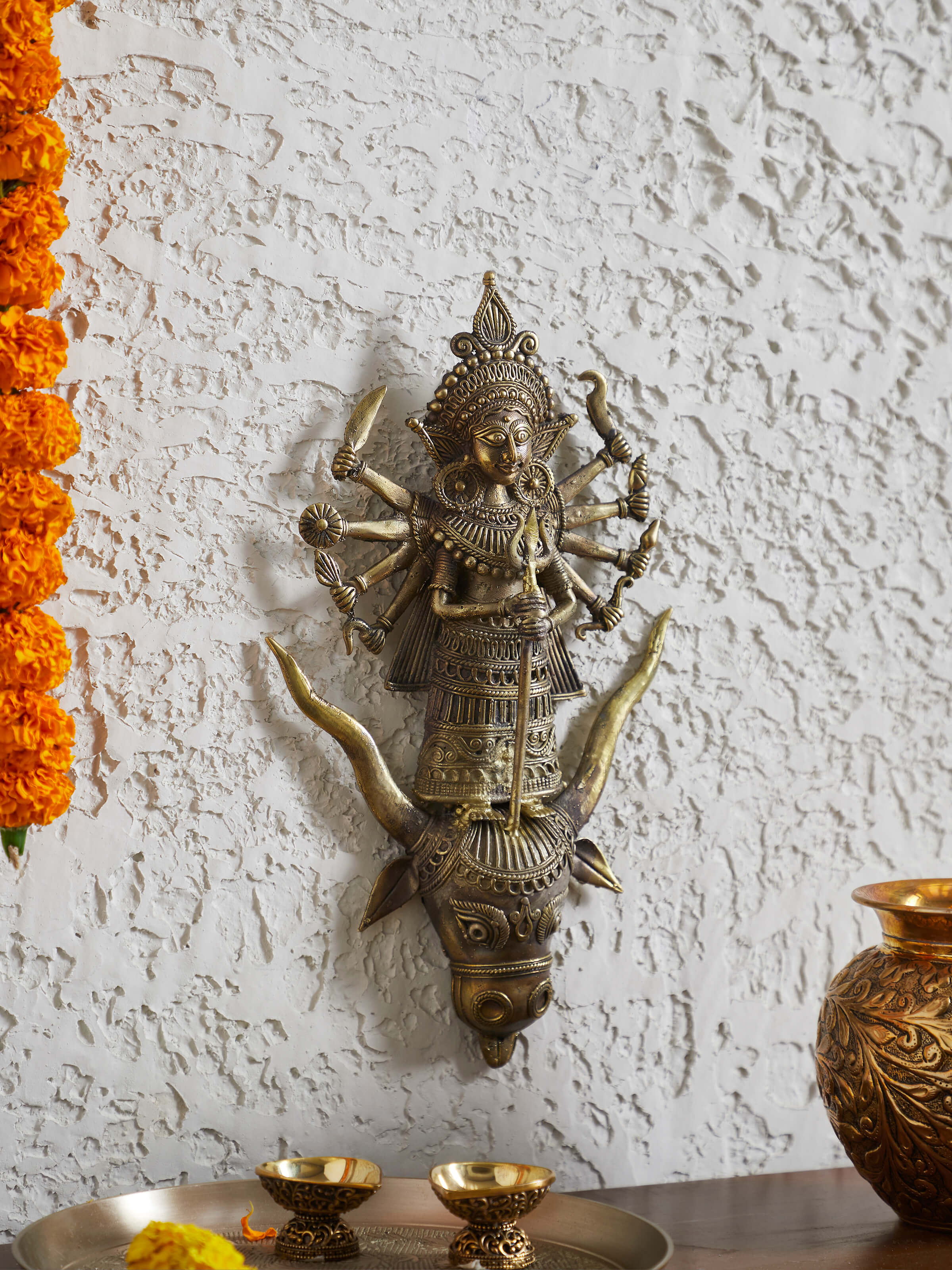 Close-up view of brass Dhokra Durga idol highlighting the intricate craftsmanship and fine detailing