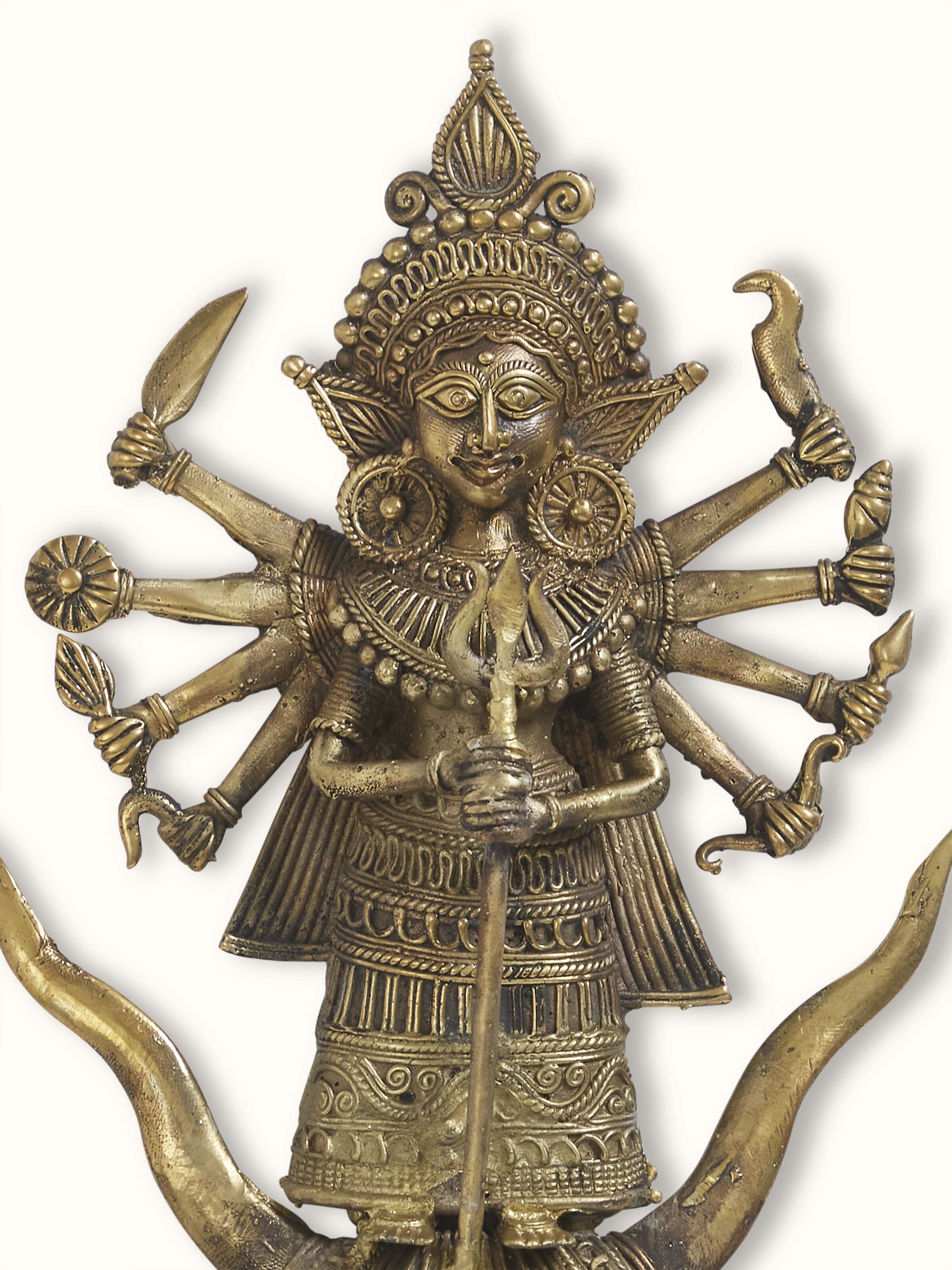 Side view of brass Dhokra Durga idol showing detailed artwork and traditional design elements