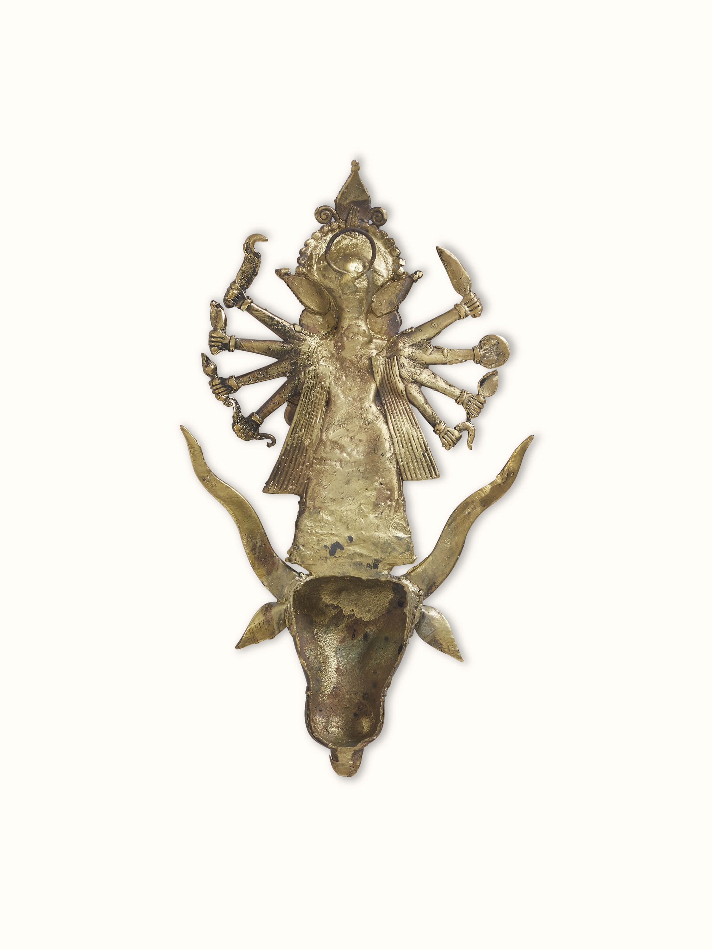 Angled view of brass Dhokra Durga idol emphasizing the depth and artistry of the metalwork