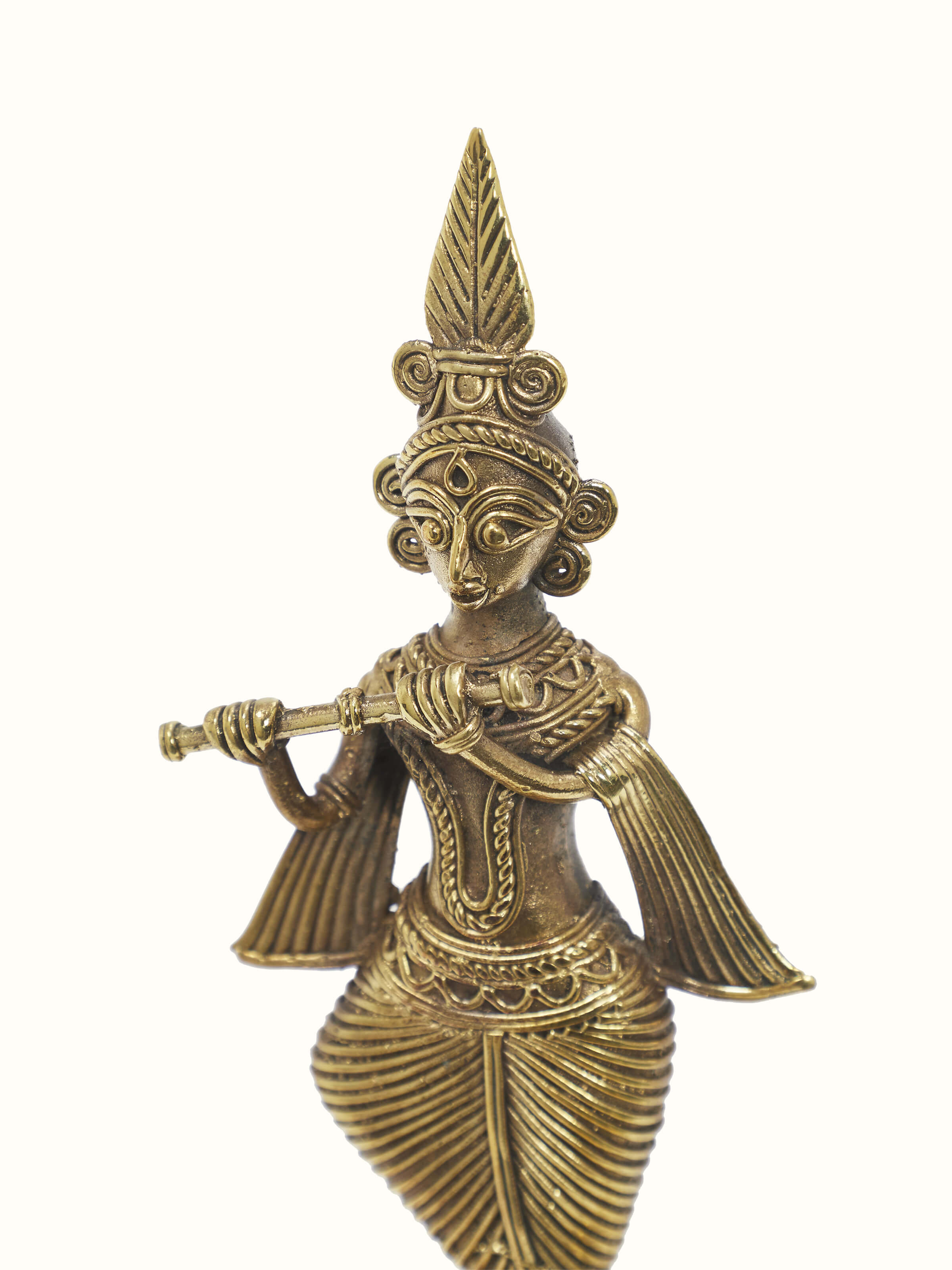 Angled view of Brass dhokra Krishna idol emphasizing the traditional dhokra art and fine brass detailing