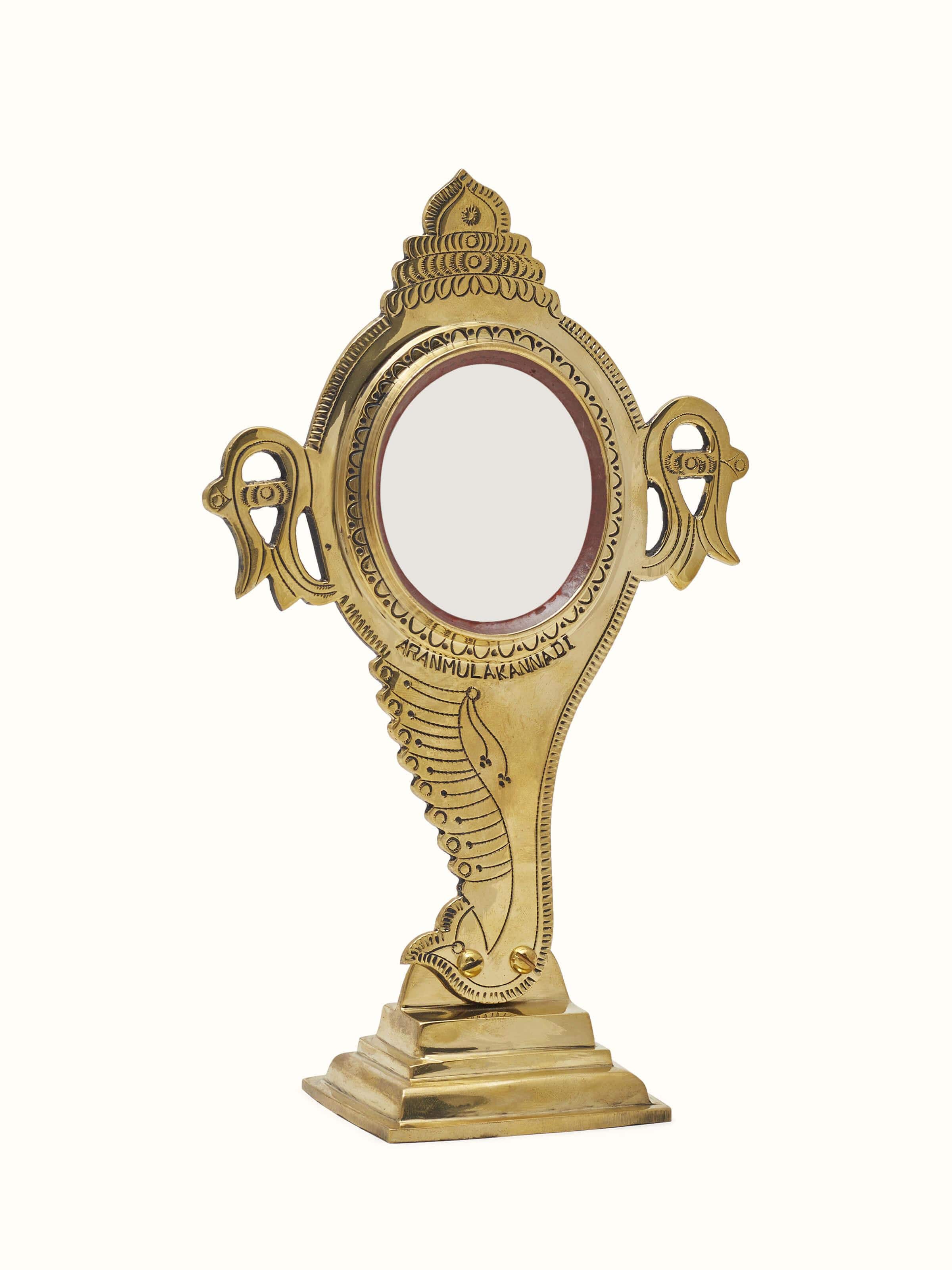 Angled view of Natural Aranmula Kannadi Brass Mirror, focusing on the craftsmanship and design elements