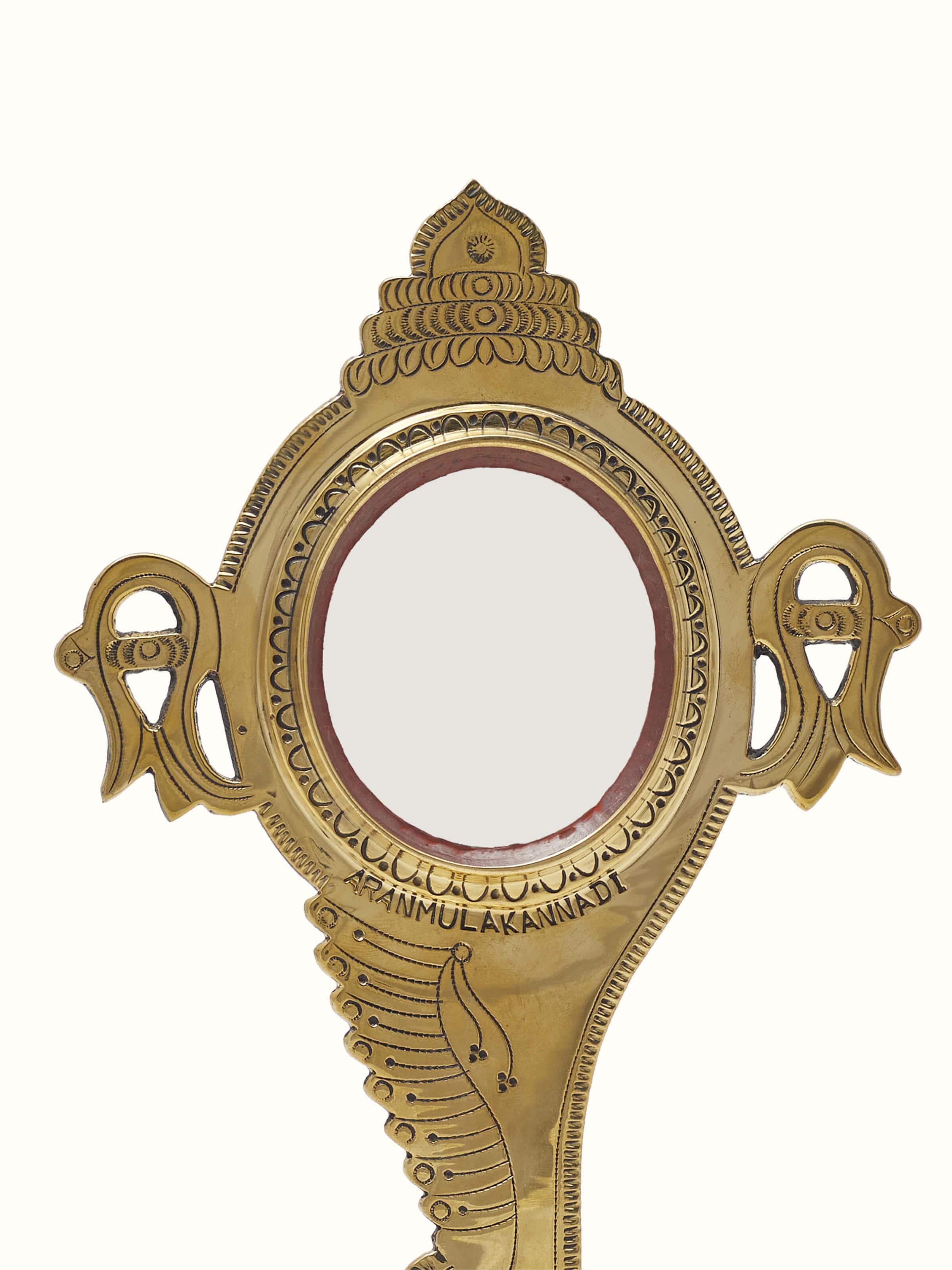 Close-up of Natural Aranmula Kannadi Brass Mirror, showing the detailed brass work and mirror finish