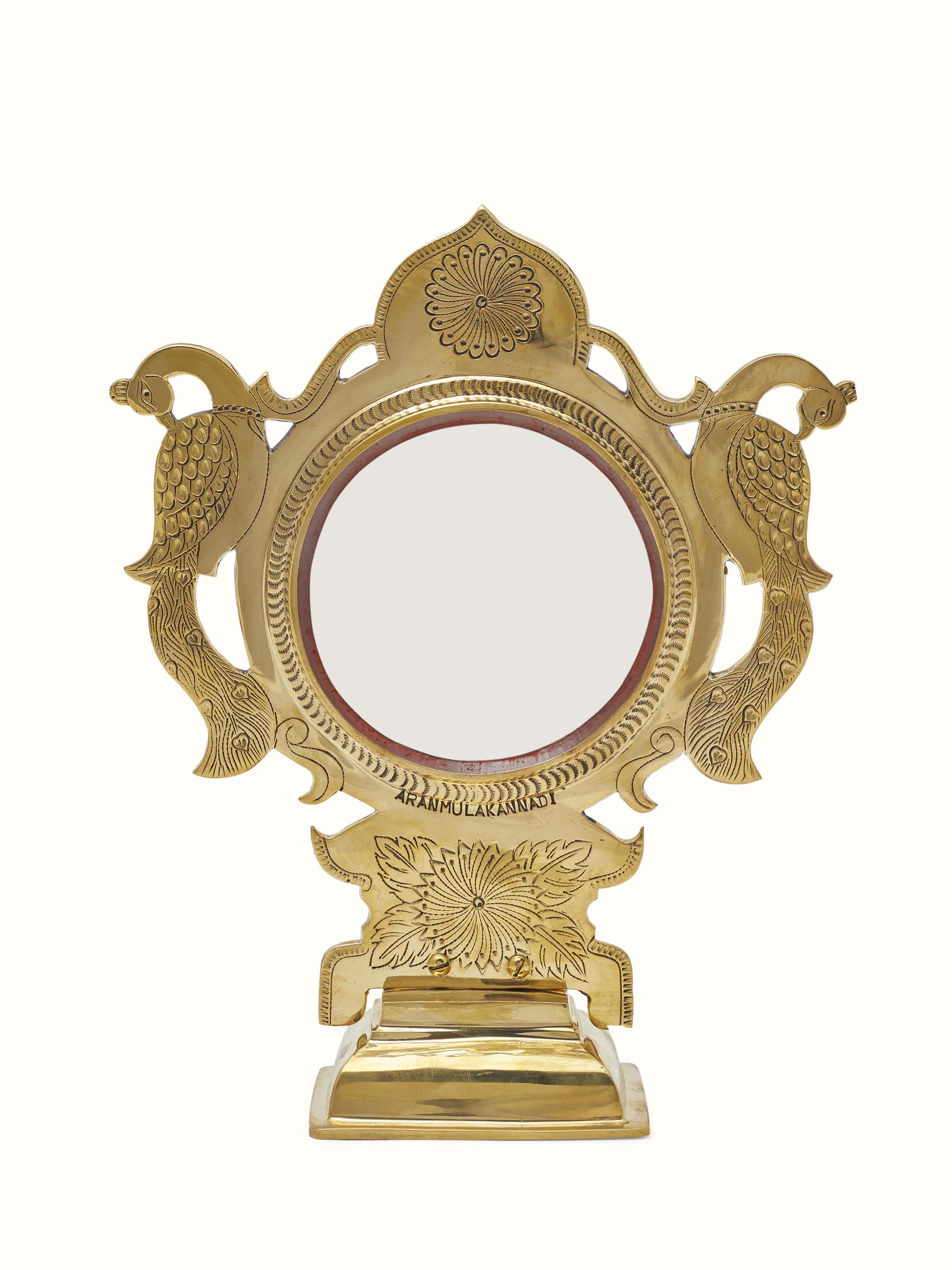 Front view of Traditional Aranmula Kannadi brass mirror displaying intricate craftsmanship and reflective surface