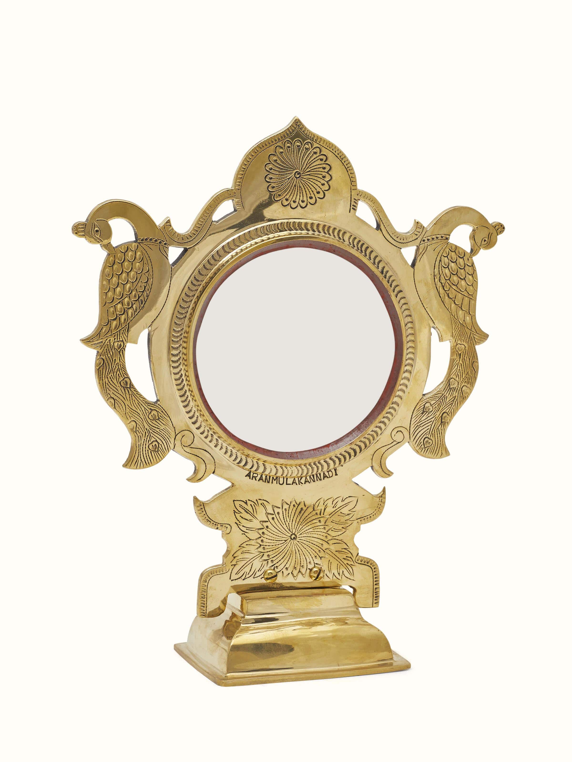 Detailed view of Traditional Aranmula Kannadi brass mirror focusing on the ornate brass work and high-quality finish