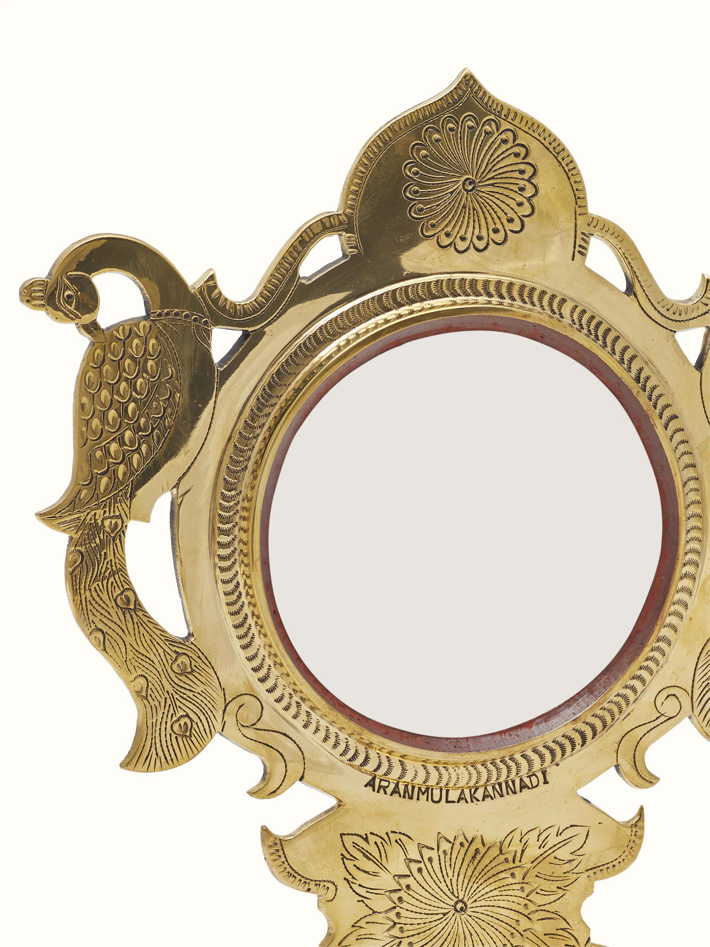 Close-up view of Traditional Aranmula Kannadi brass mirror showcasing the fine detailing and craftsmanship